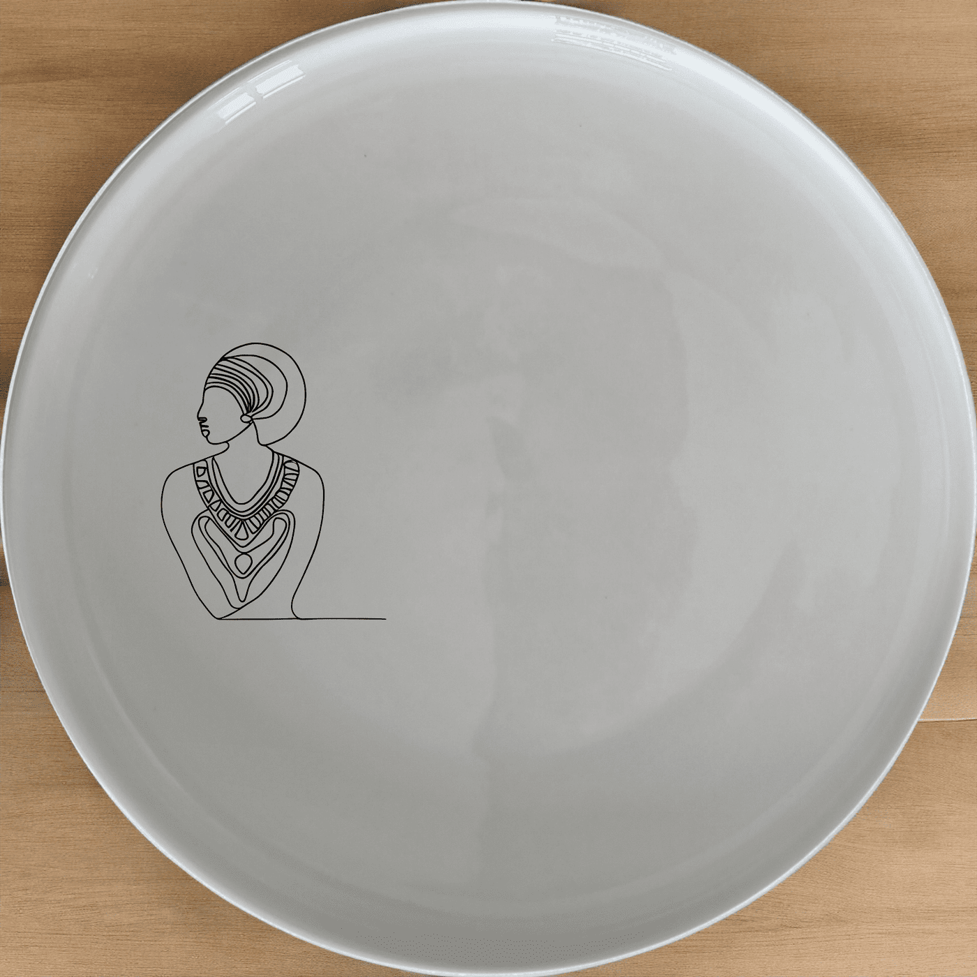 The African Geometric Tribal Pattern Design Dinner Plate Set of 4 features a striking geometric pattern inspired by African tribal art, perfect for adding a touch of cultural elegance to your dining table.