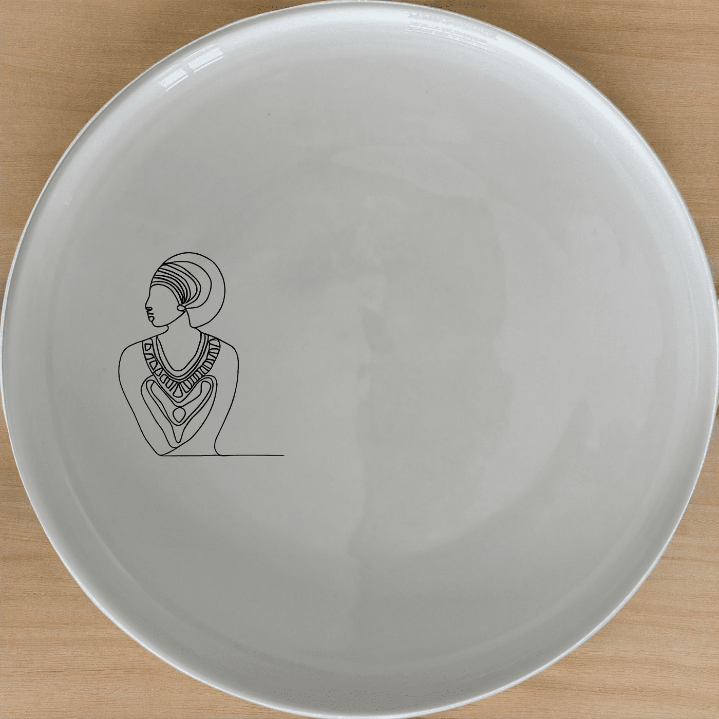 The African Geometric Tribal Pattern Design Side Plate Set of 4 features a striking geometric design inspired by African tribal art, perfect for adding a touch of cultural elegance to your dining table.