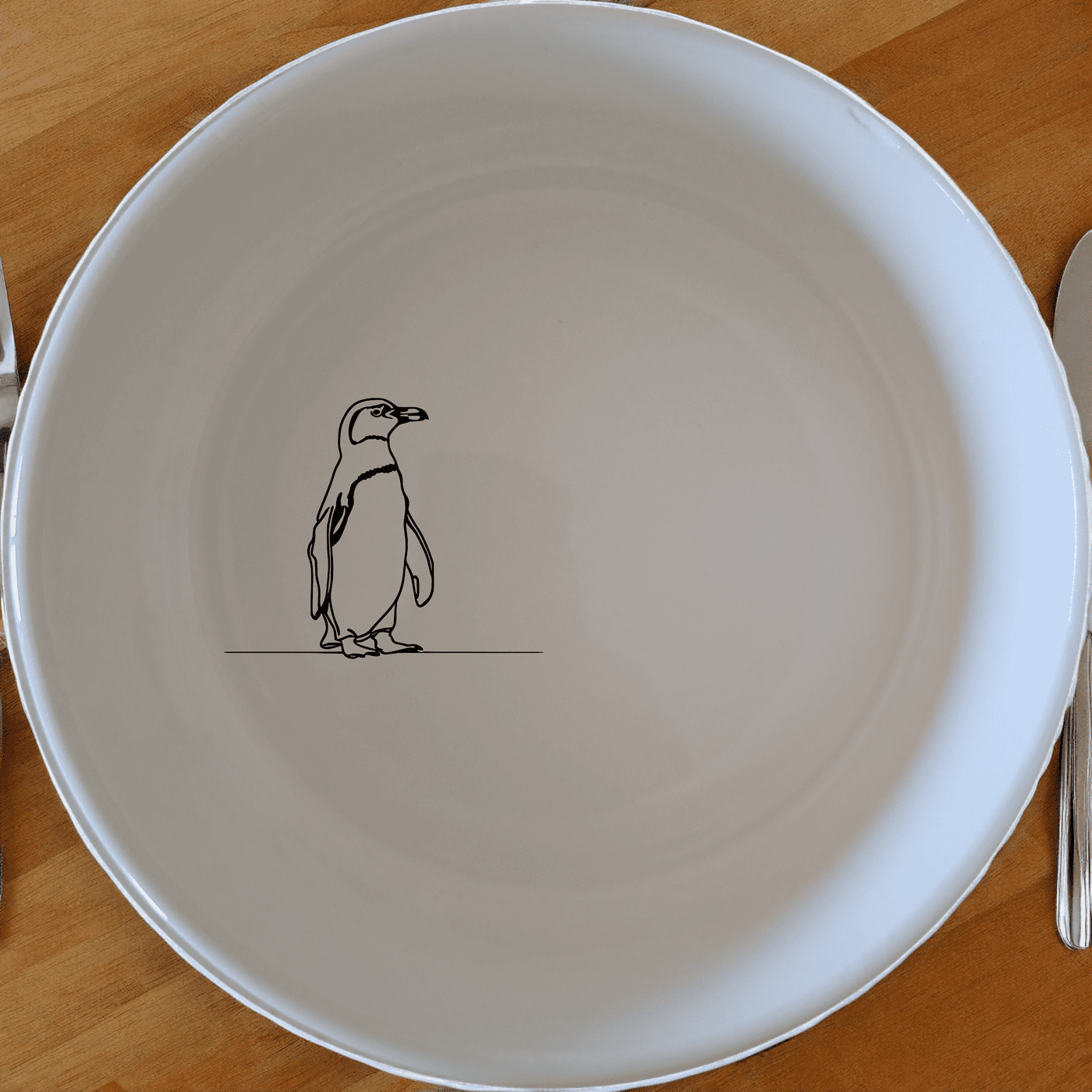 The African Penguin Silhouettes Bowl Set of 4 adds a touch of whimsy to your table setting with charming penguin designs.