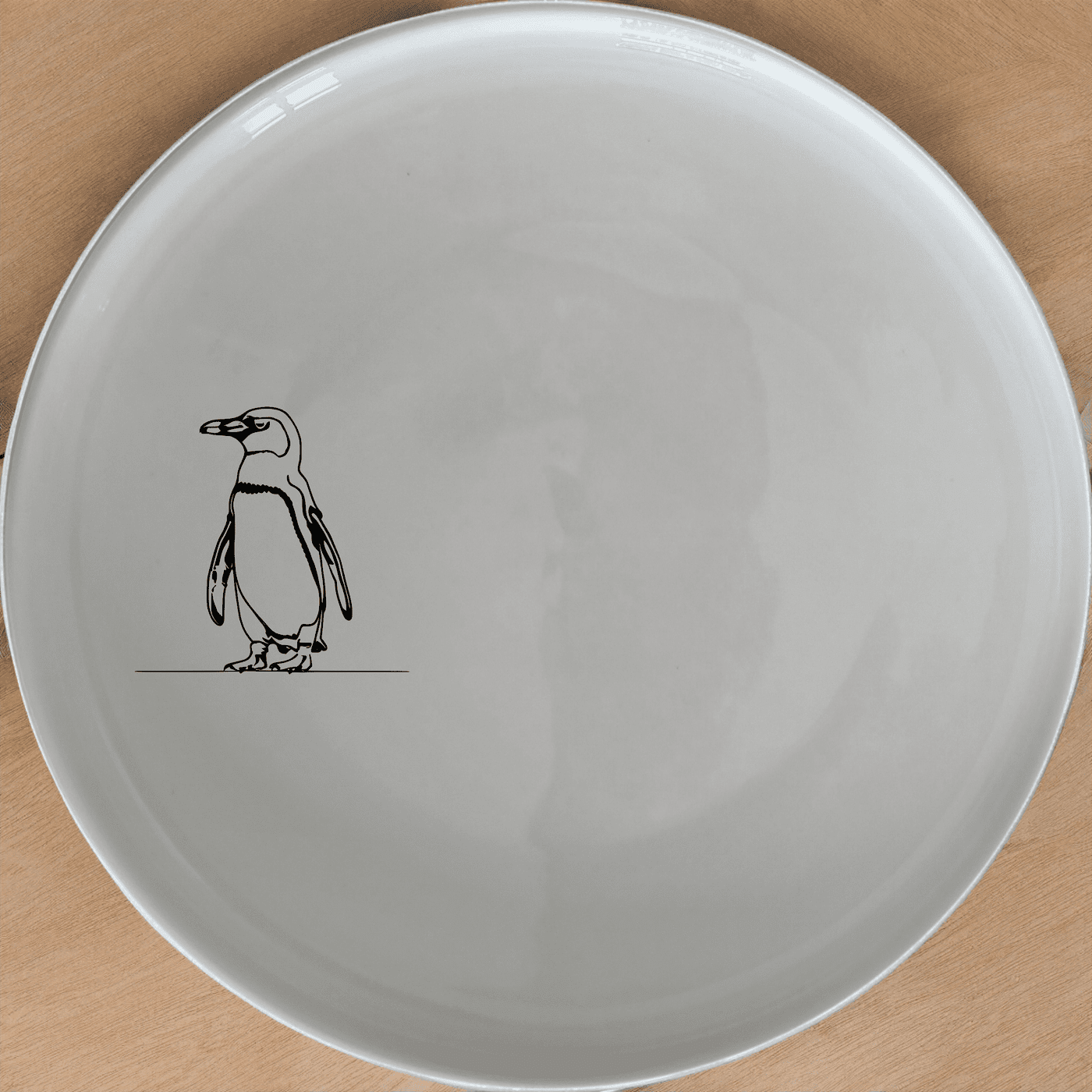 African Penguin Dinner Plate Set of 4 features minimalist penguin silhouettes for a modern, artistic touch to your dining experience.