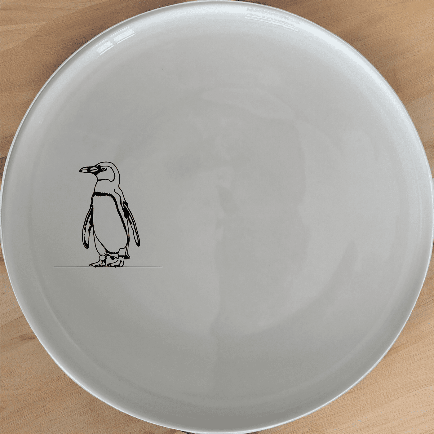 African Penguin Side Plate Set of 4 offers a charming silhouette design perfect for modern dining. Crafted from durable ceramic, these plates are microwave and dishwasher safe, making them ideal for everyday use.