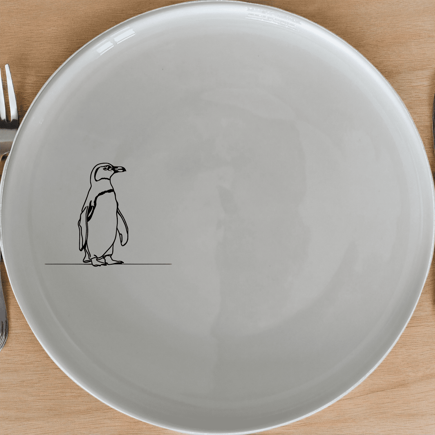 The African Penguin Side Plate Set of 4 features minimalist penguin silhouettes, perfect for modern dining and adding a touch of nature to your table.