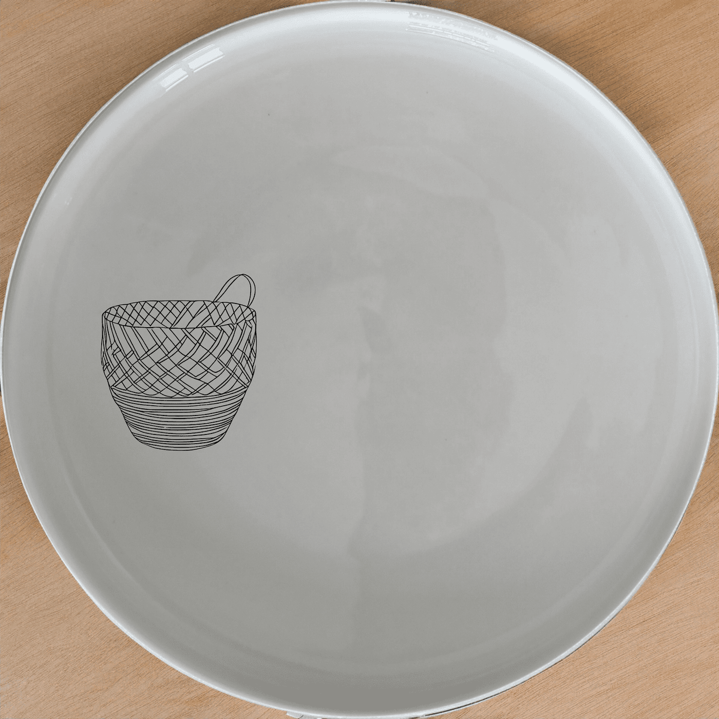 The African Woven Basket Side Plate Set of 4 features a unique basket design etched onto white ceramic plates, perfect for modern dining.