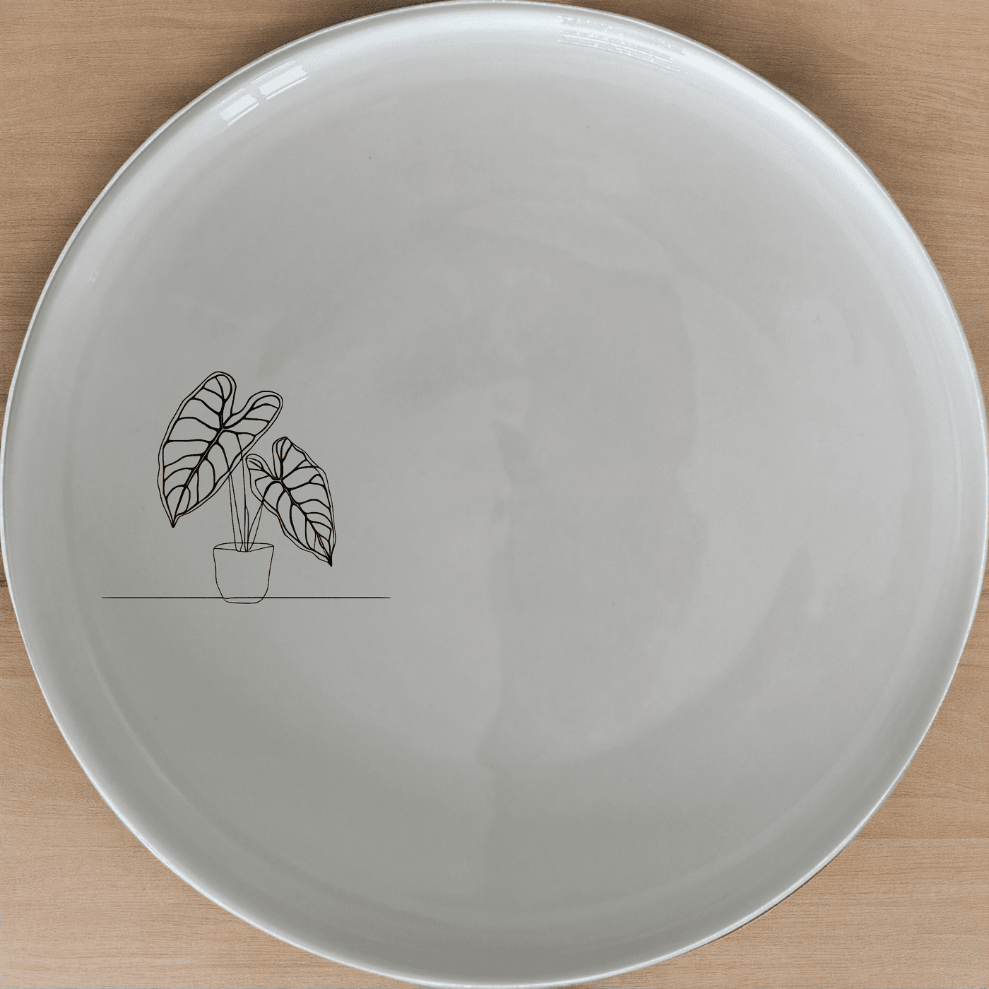 Alocasia Zebrina Dinner Plate Set of 4 features minimalist design perfect for modern dining. Crafted from durable ceramic, this set adds a touch of nature to your table setting.