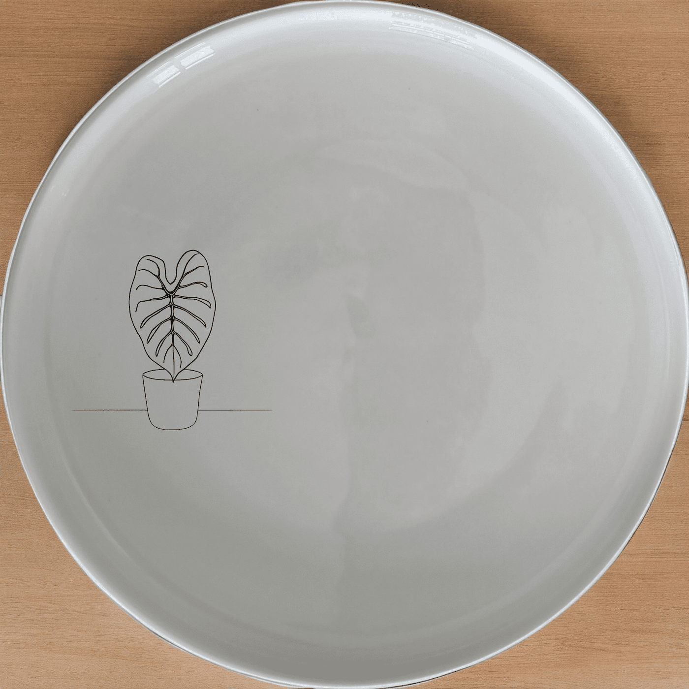 The Alocasia Zebrina Side Plate Set of 4 adds a touch of modern elegance to your dining table with its minimalist design and subtle botanical motif.