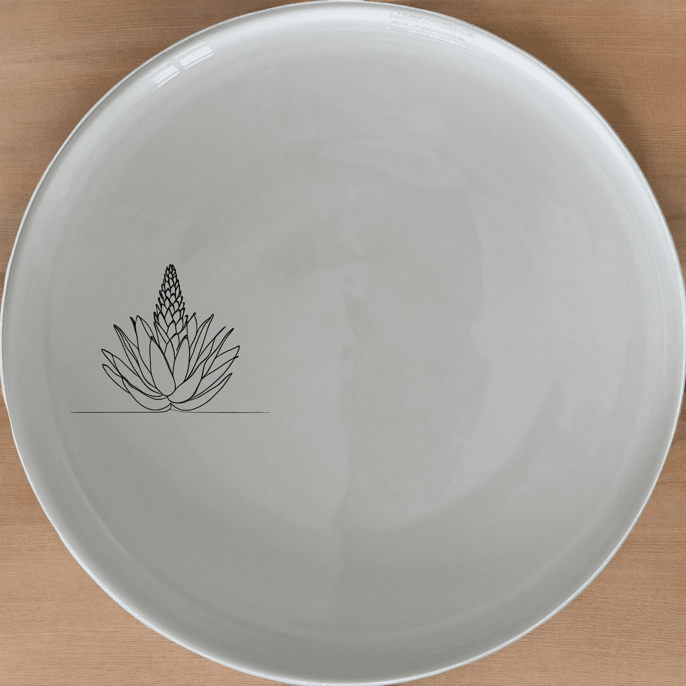 The Aloe Ferox Flower Spike Side Plate Set of 4 features a minimalist design with a delicate aloe flower illustration, perfect for modern dining.