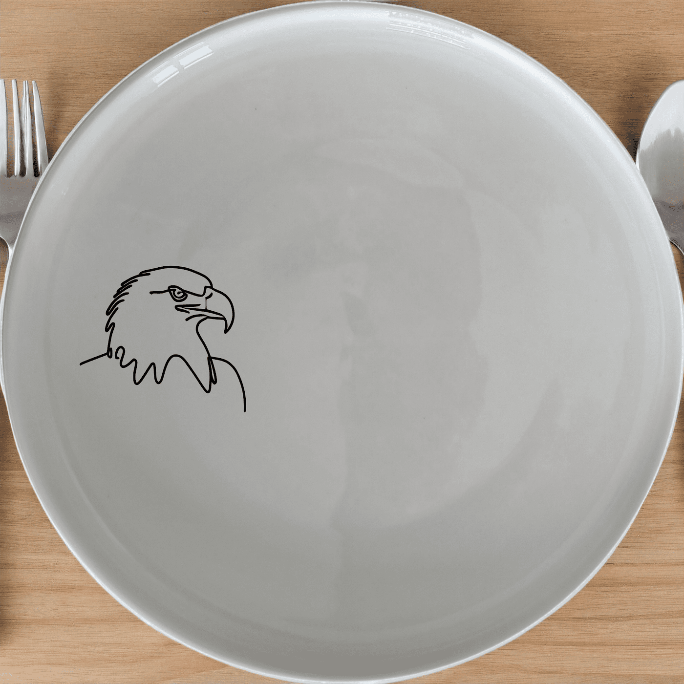 American Bald Eagle Side Plate Set of 4 features a striking eagle design on a classic white ceramic plate, perfect for everyday use or special occasions.