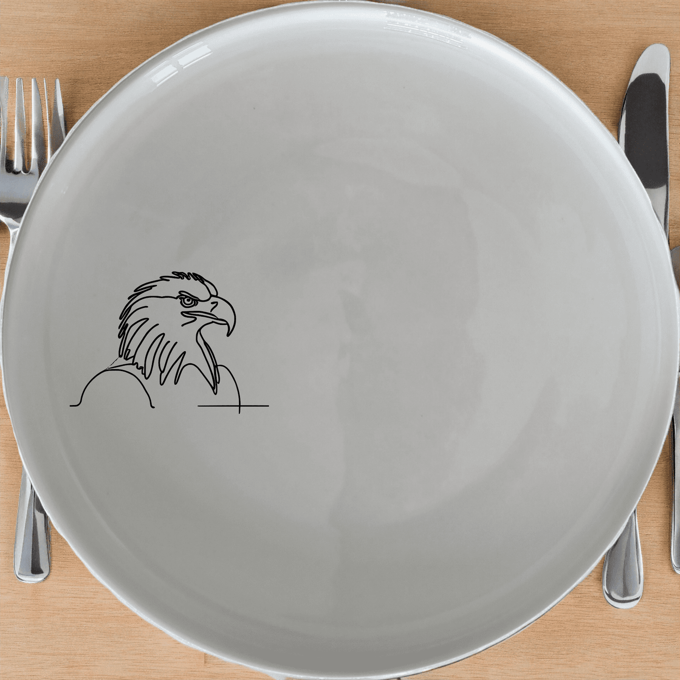 The American Bald Eagle Side Plate Set of 4 features a striking silhouette design, perfect for adding a touch of national pride to any dining table.