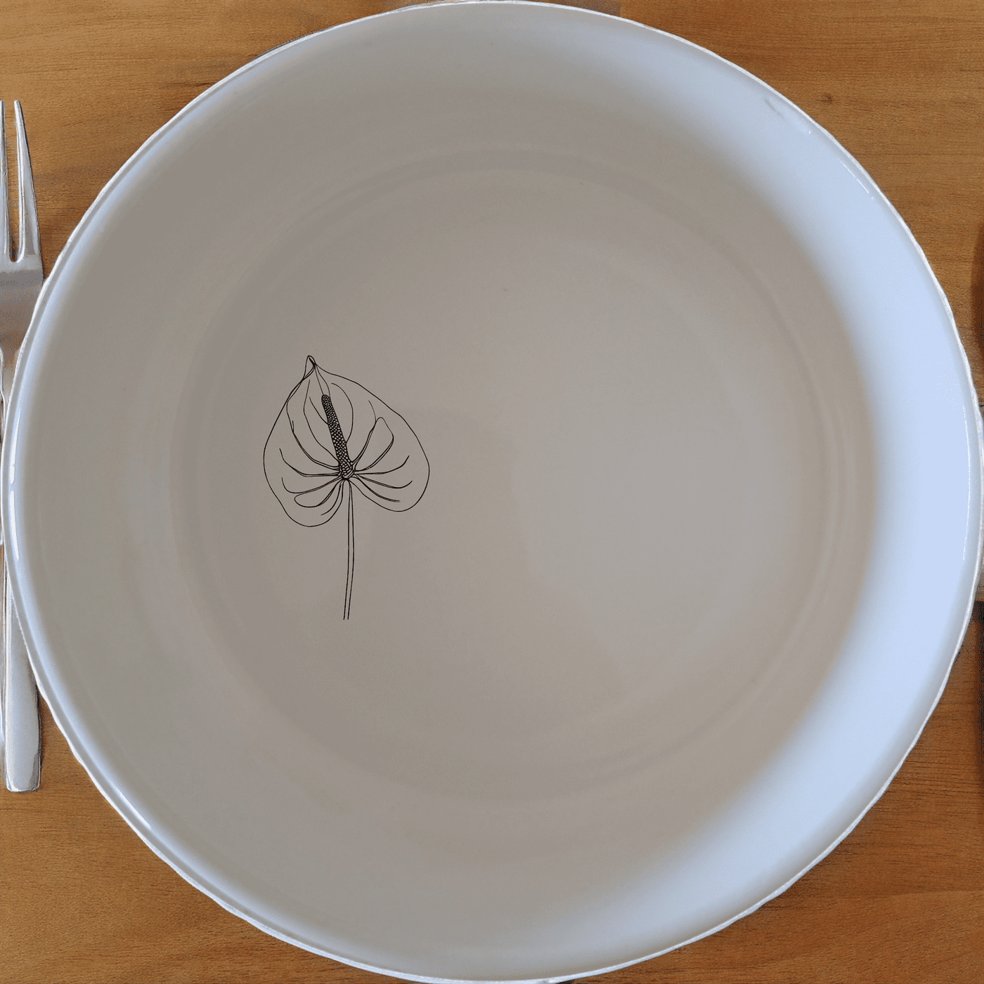 The Anthurium Clarinervium Bowl Set of 4 features a delicate botanical design, perfect for everyday use or special occasions.