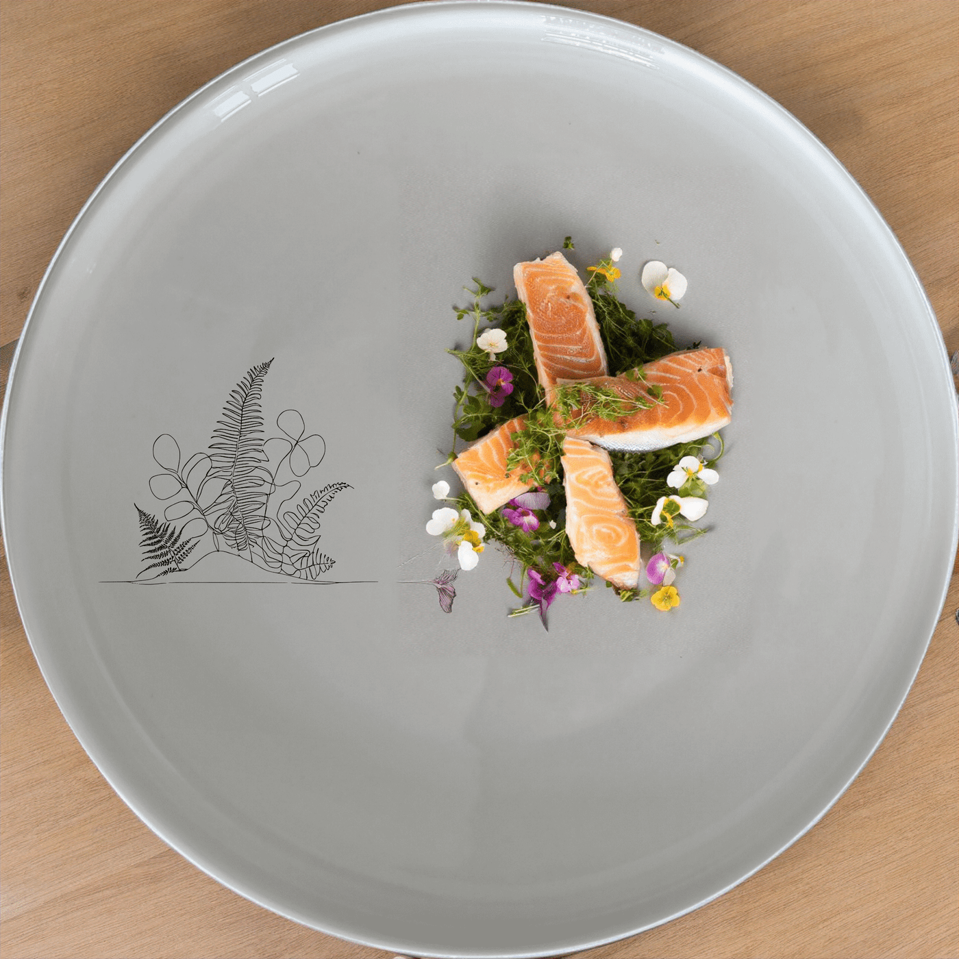 The Aroids Ferns Dinner Plate Set of 4 features a minimalist design with delicate botanical illustrations, perfect for modern dining settings.