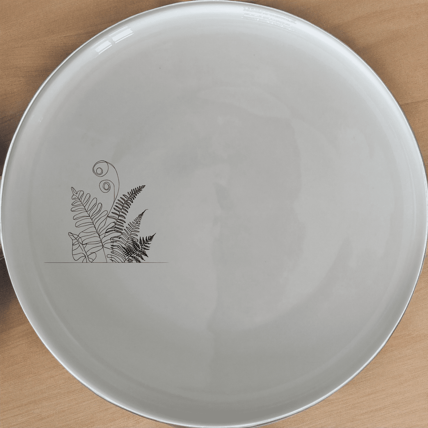 The Aroids and Ferns Side Plate Set of 4 features delicate botanical designs, perfect for adding a touch of nature to your dining table.
