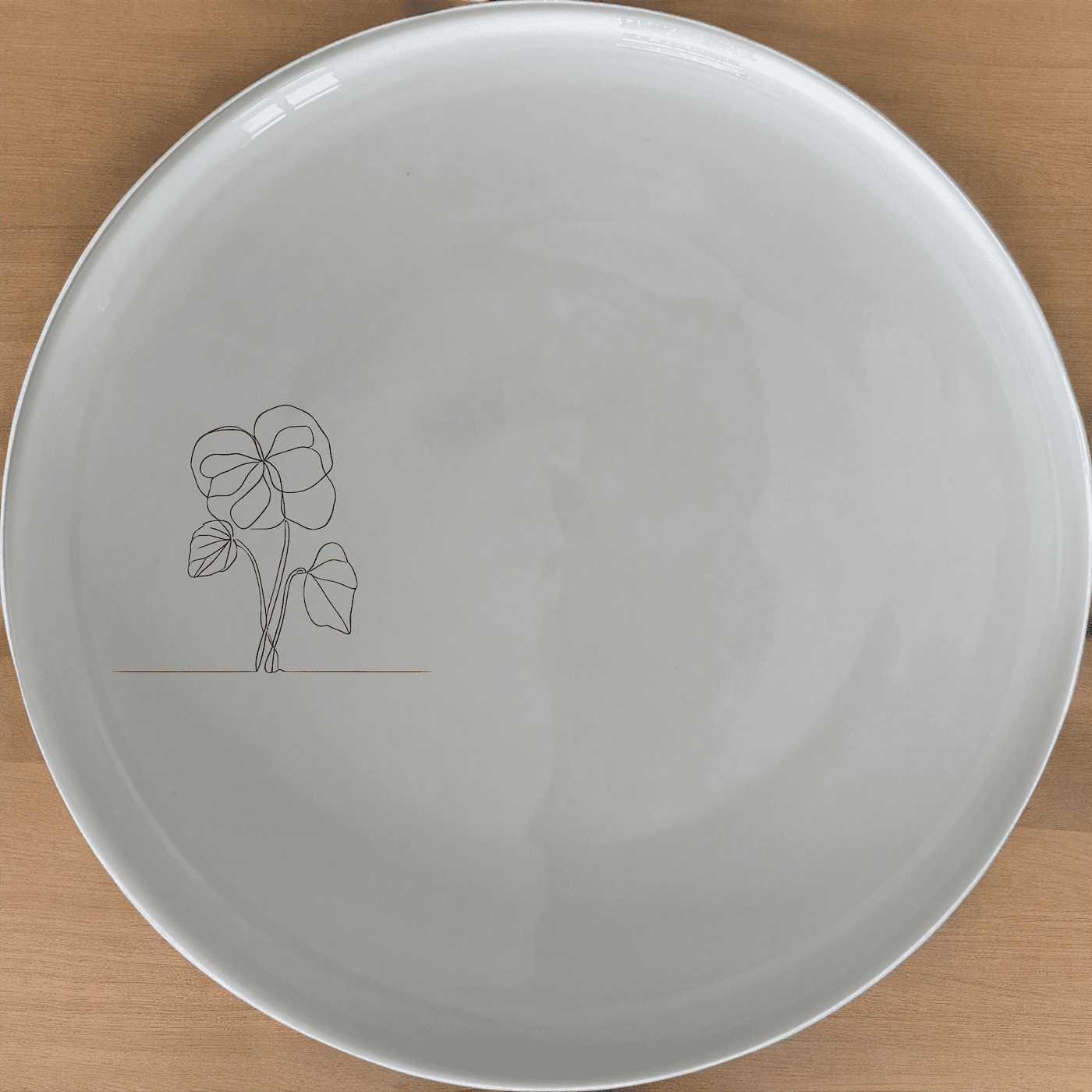 The Begonia Maculata Side Plate Set of 4 features a delicate laser-etched design, perfect for adding a touch of elegance to any dining table.