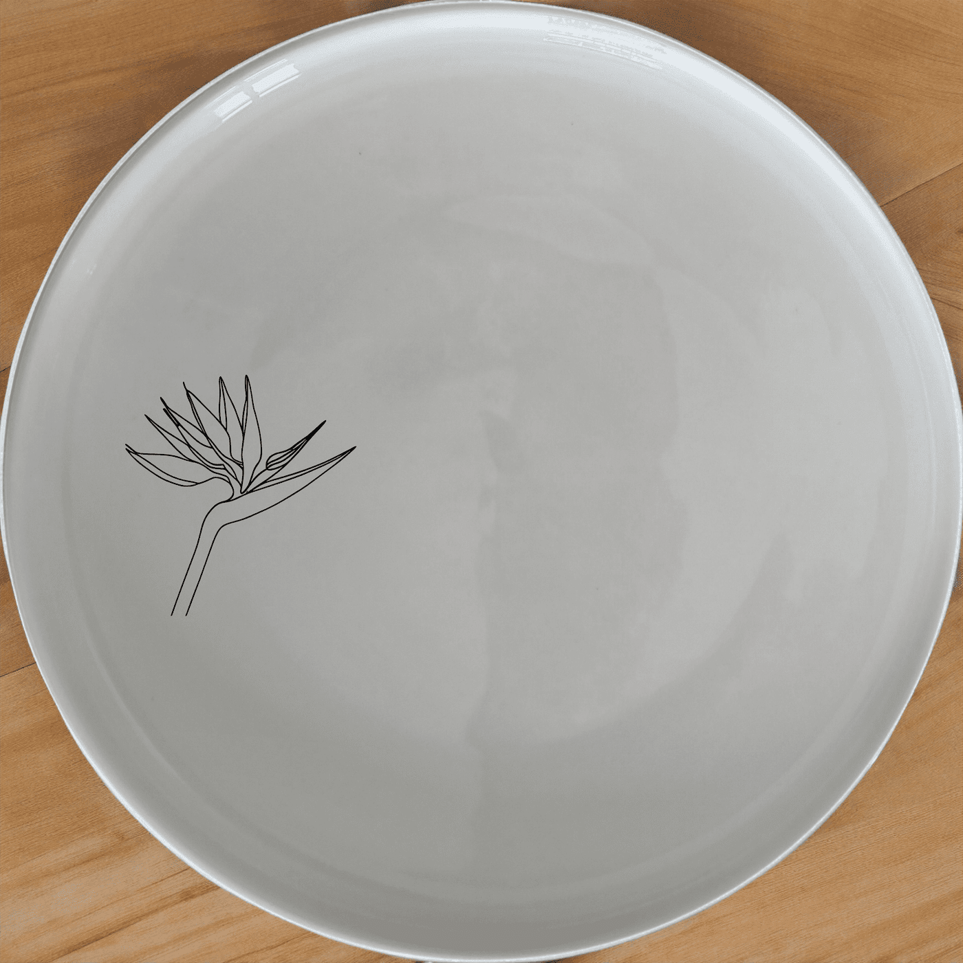 Elevate your dining experience with the Bird of Paradise Dinner Plate Set of 4, featuring elegant laser-etched designs.