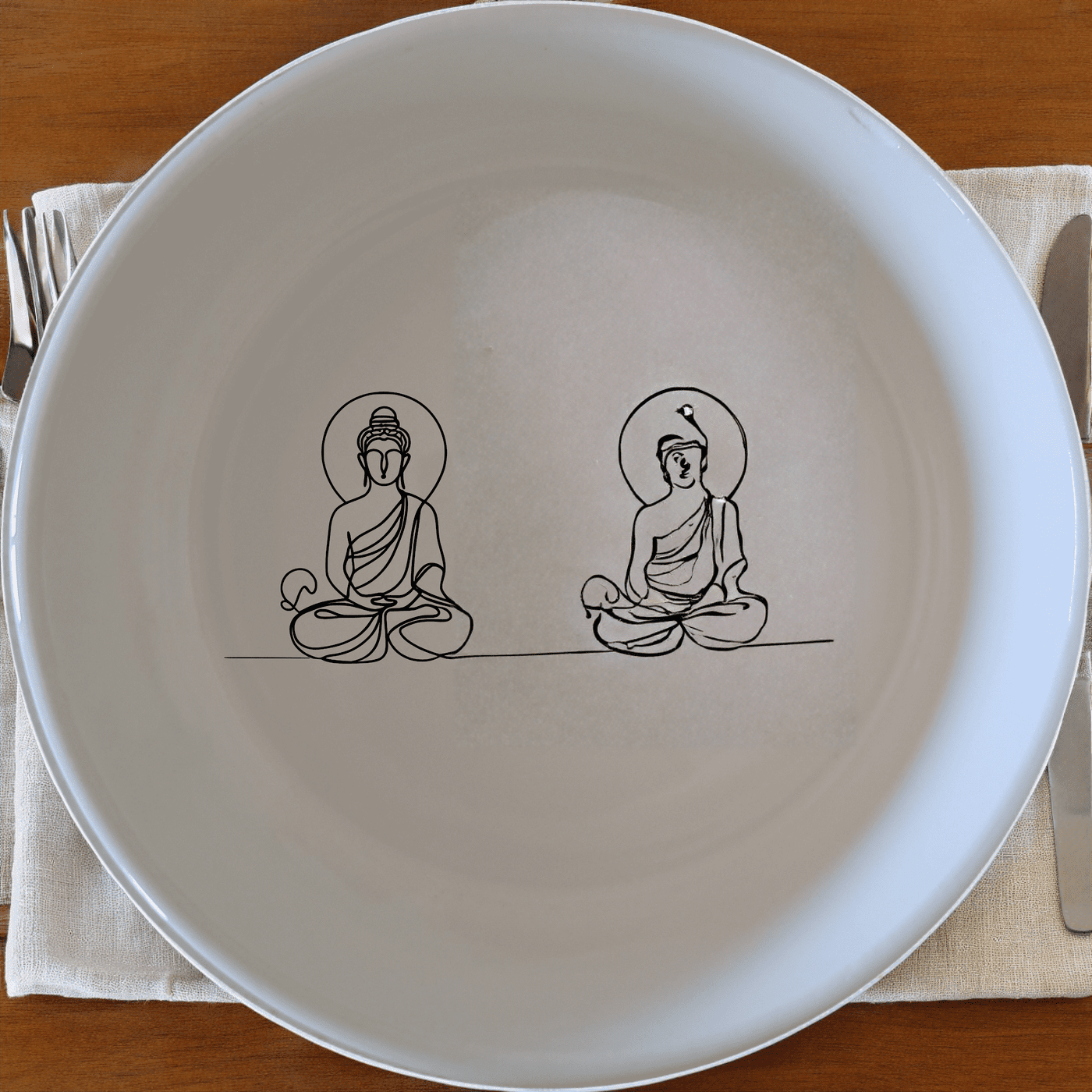Budist Imagery Bowl Set of 4 is a beautifully designed set of four white ceramic bowls, each featuring a serene Buddha figure in a meditative pose, perfect for adding a touch of tranquility to your dining experience.