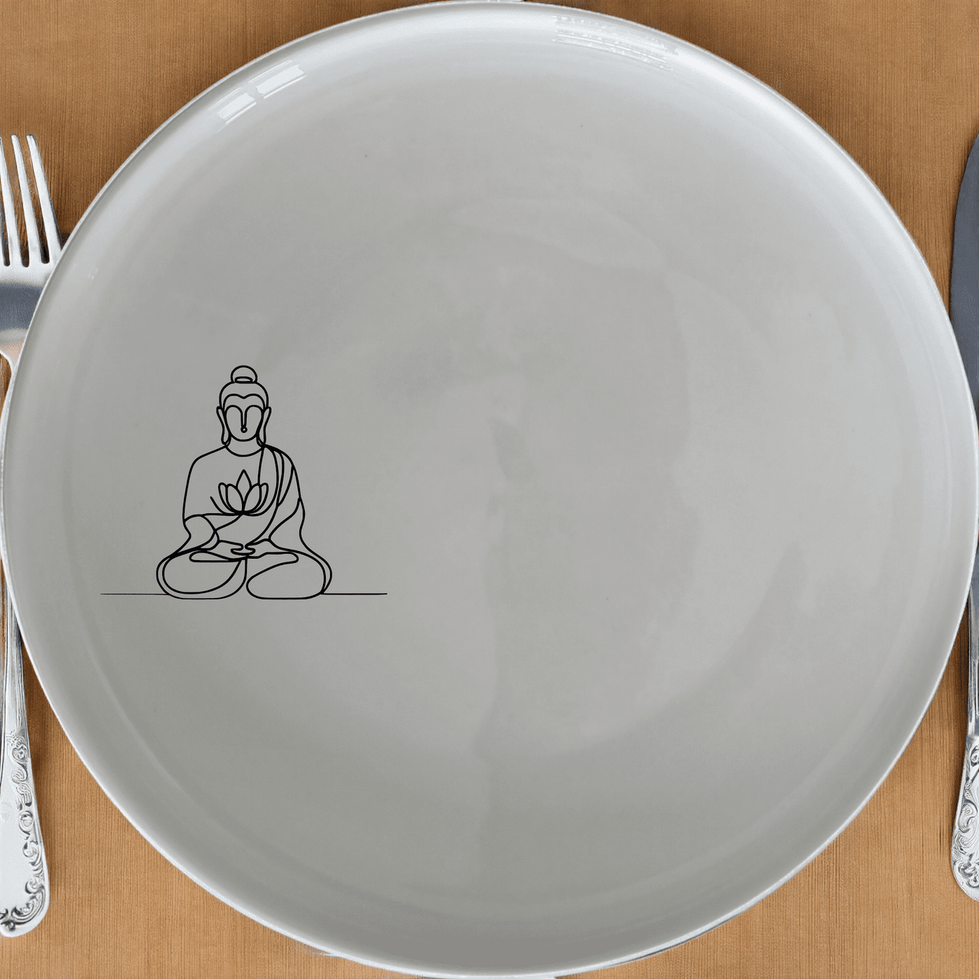The Budist Imagery Dinner Plate Set of 4 features a serene and minimalist design, perfect for elevating your dining experience with a touch of tranquility and artistic elegance.