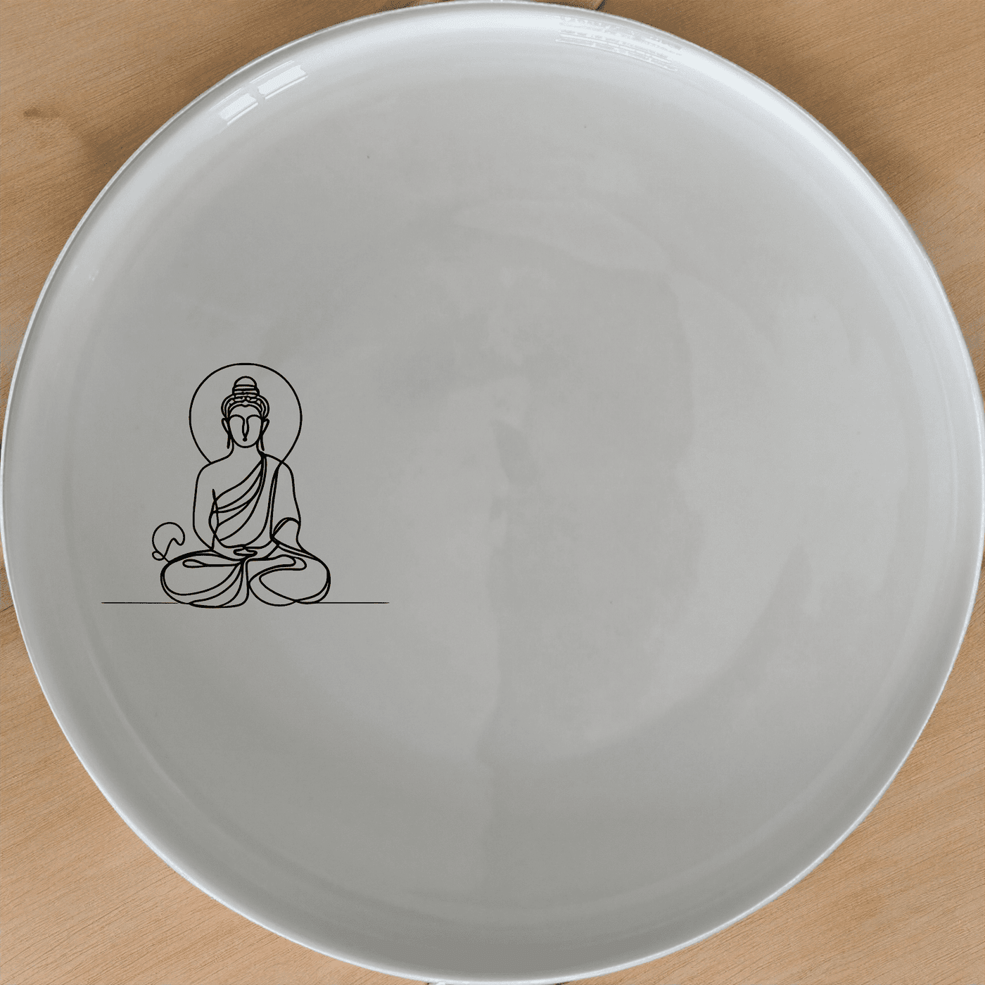 The Budist Imagery Dinner Plate Set of 4 features a serene and minimalist design, perfect for elevating any dining experience.