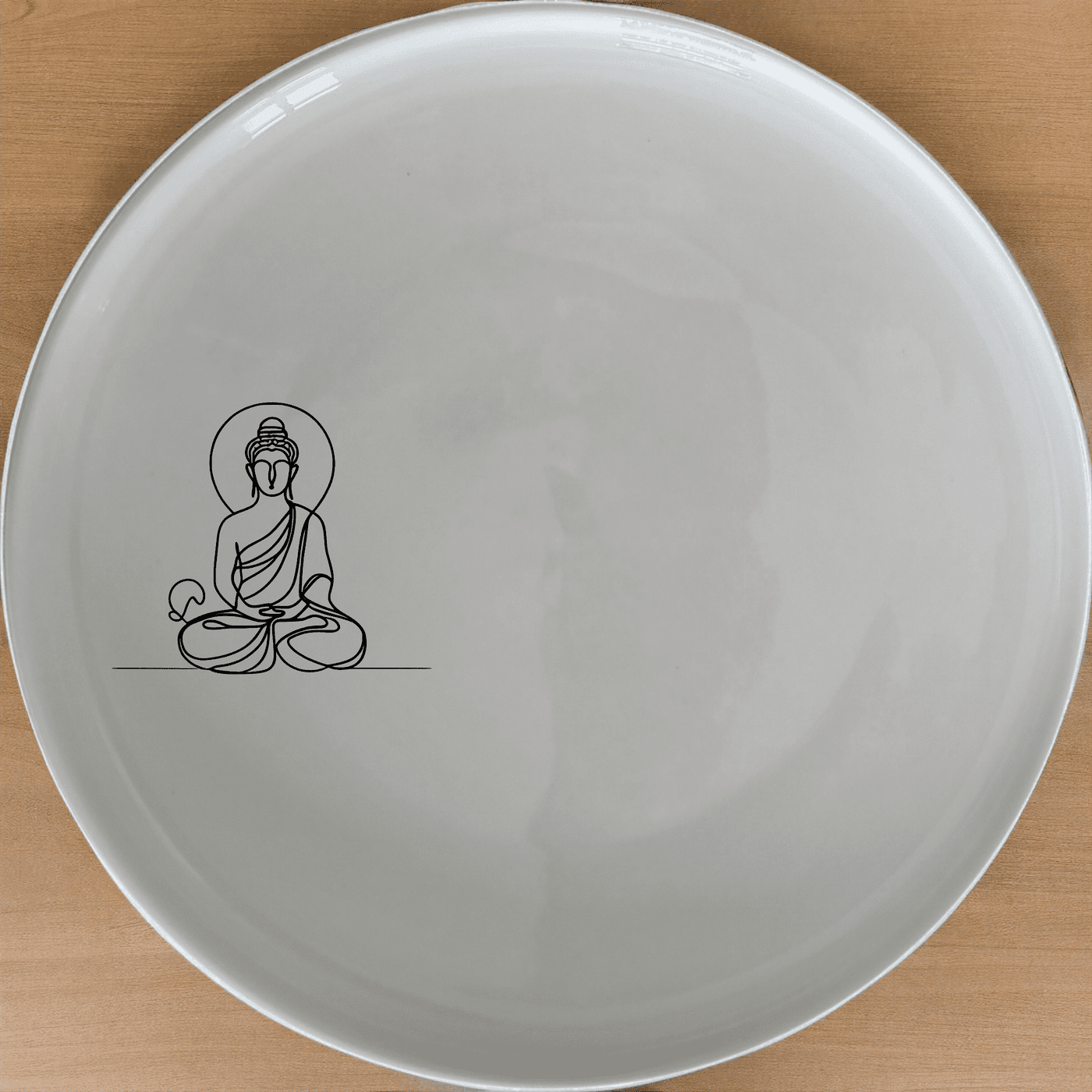 The Budist Imagery Side Plate Set of 4 features a serene and minimalist design, perfect for adding a touch of tranquility to any dining setting.