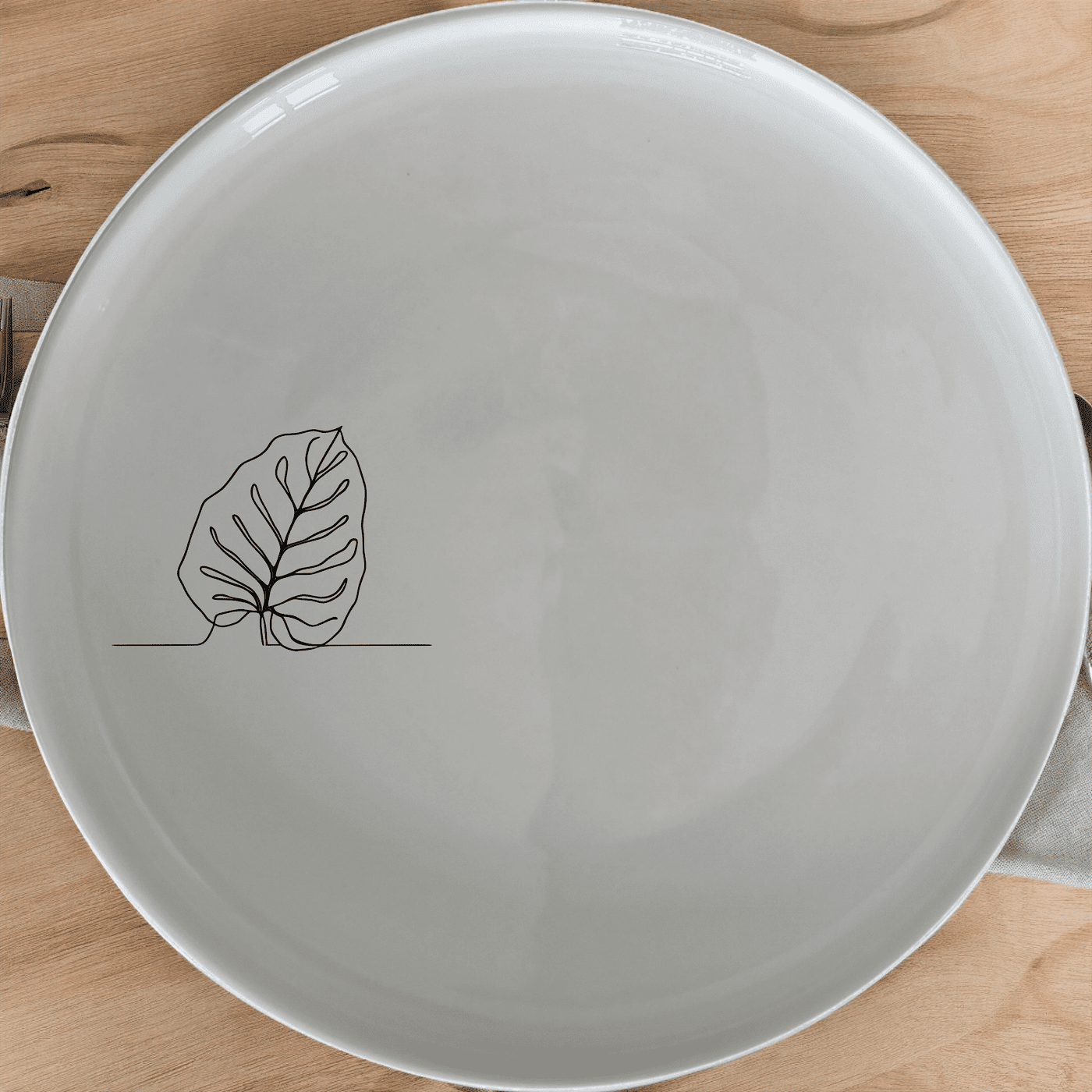 The Orbifolia Leaf Side Plate Set of 4 adds a touch of nature to your dining table with its elegant leaf design.