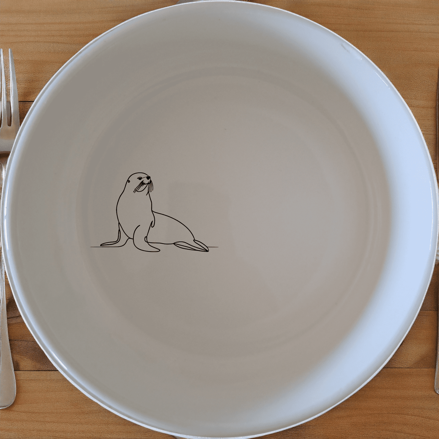 The Cape Fur Seal Bowl Set of 4 features elegant silhouettes on white ceramic, perfect for modern dining and gifting.