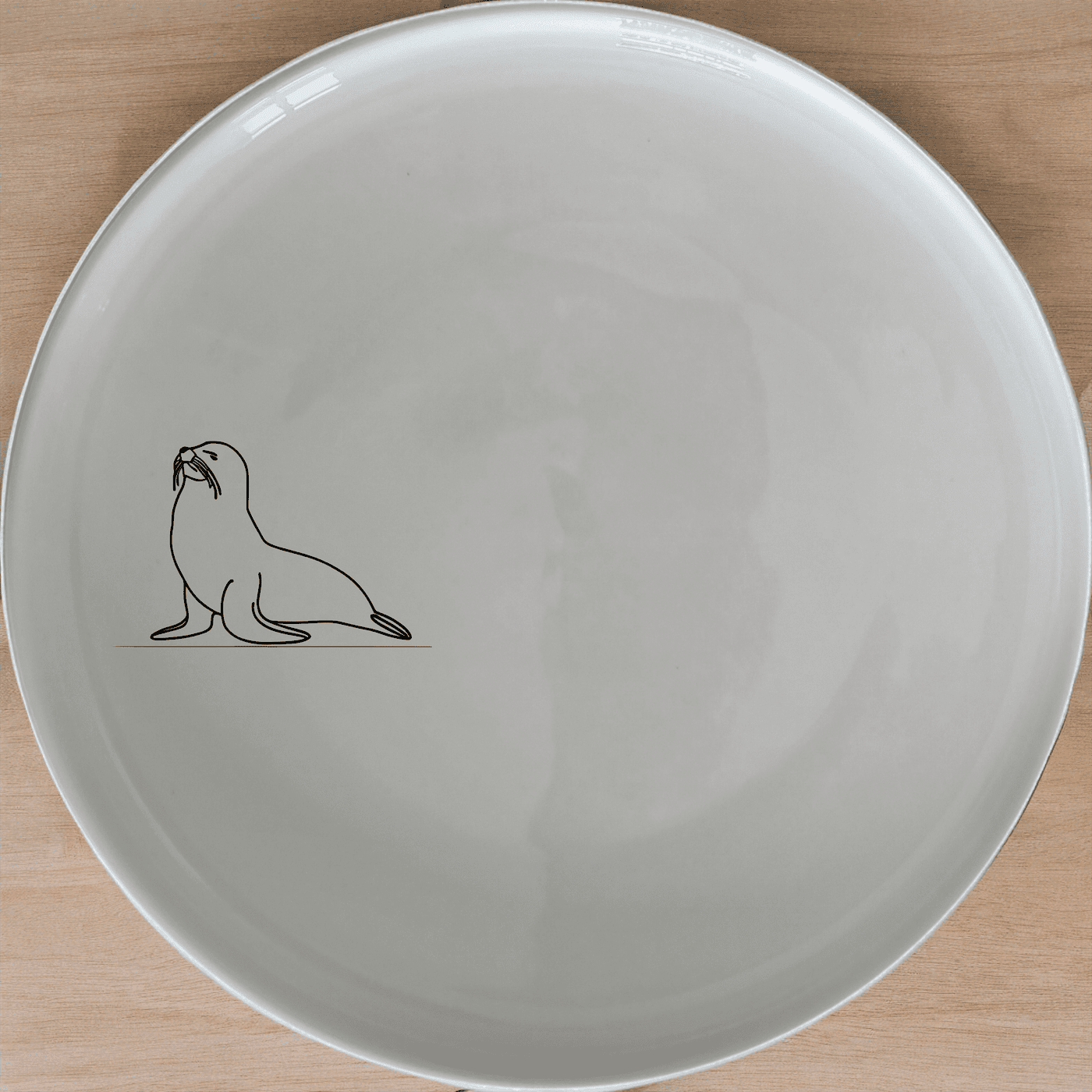 The Cape Fur Seal Dinner Plate Set of 4 features elegant silhouettes on white ceramic plates, perfect for modern dining.