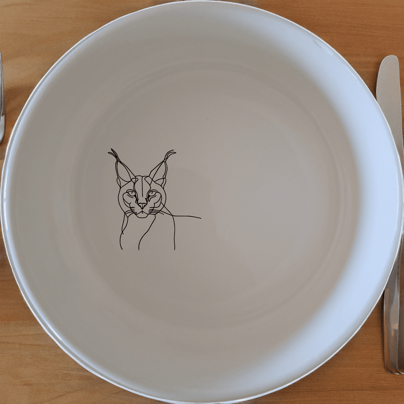 The Caracal Ears Tufted Feline Bowl Set of 4 adds a touch of exotic elegance to your table setting with its unique design.