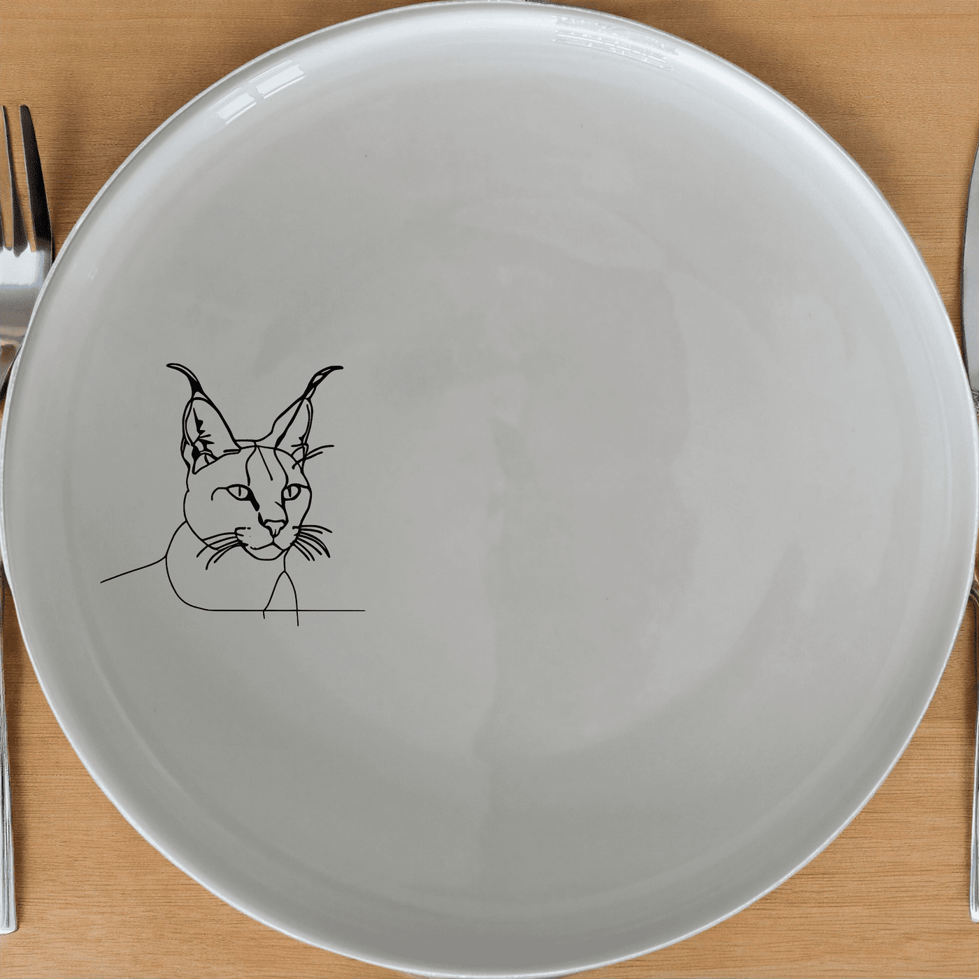 The Caracal Ears Tufted Feline Dinner Plate Set of 4 features a sleek, minimalist design perfect for modern dining. Crafted from durable ceramic, these plates are microwave and dishwasher safe, making them ideal for everyday use.
