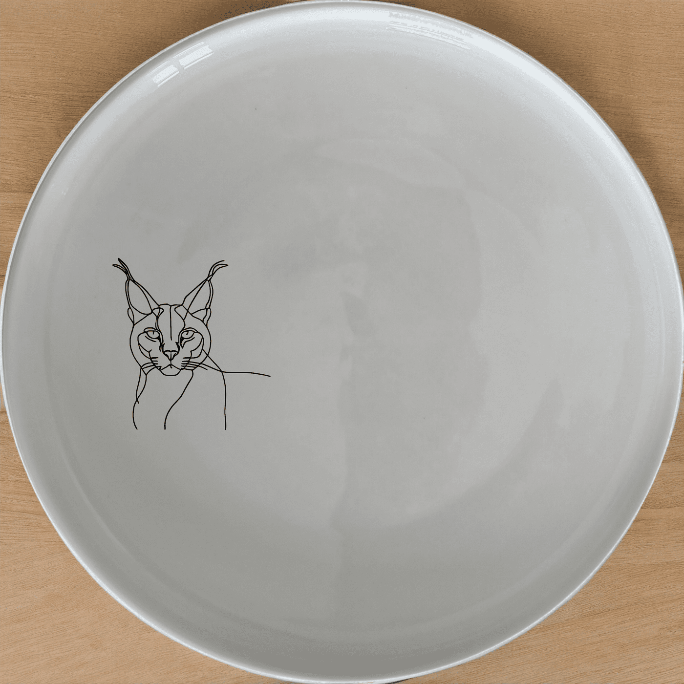 The Caracal Ears Tufted Feline Dinner Plate Set of 4 features sleek, minimalist designs perfect for modern dining. Crafted from durable ceramic, these plates are microwave and dishwasher safe, making them ideal for everyday use.