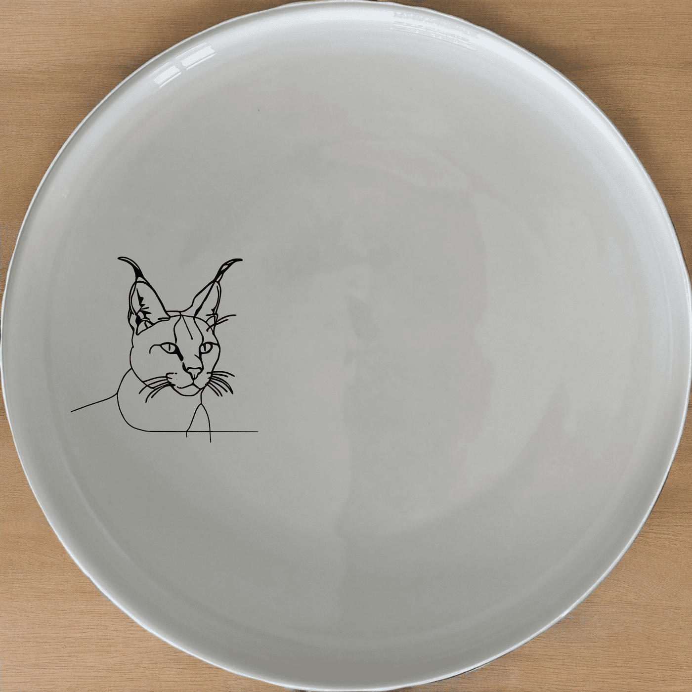 Caracal Ears Tufted Feline Side Plate Set of 4 features sleek, minimalist design perfect for modern dining. Crafted from durable ceramic, these plates are microwave and dishwasher safe.