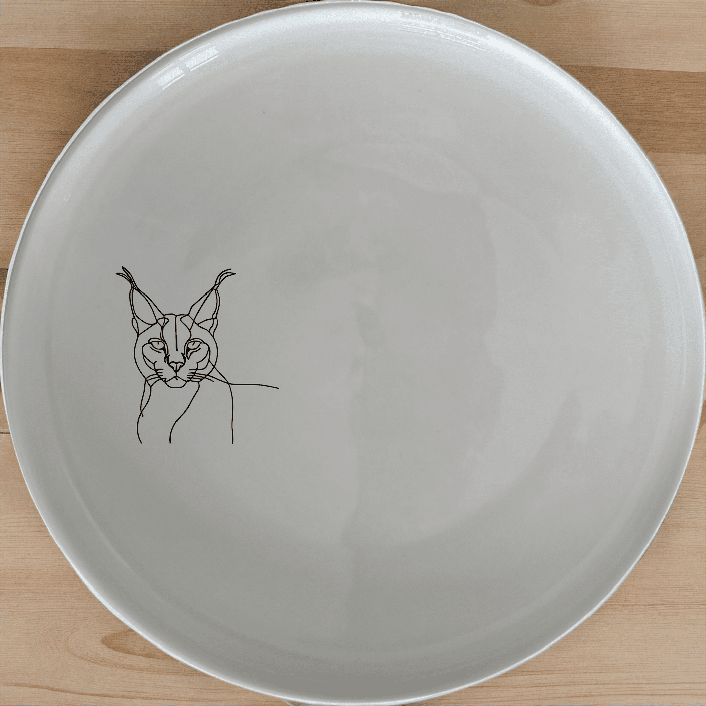 The Caracal Ears Tufted Feline Side Plate Set of 4 adds a unique touch to your dining table with its elegant design and high-quality ceramic construction.