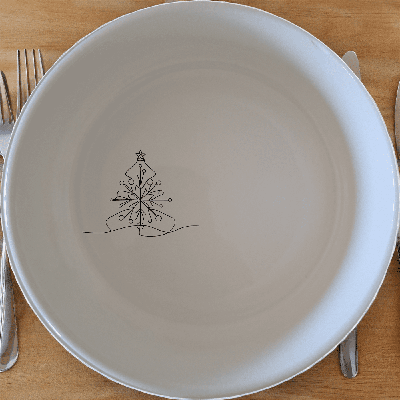 The Christmas Imagery Bowl Set of 4 adds festive charm to your dining table with elegant Christmas designs.