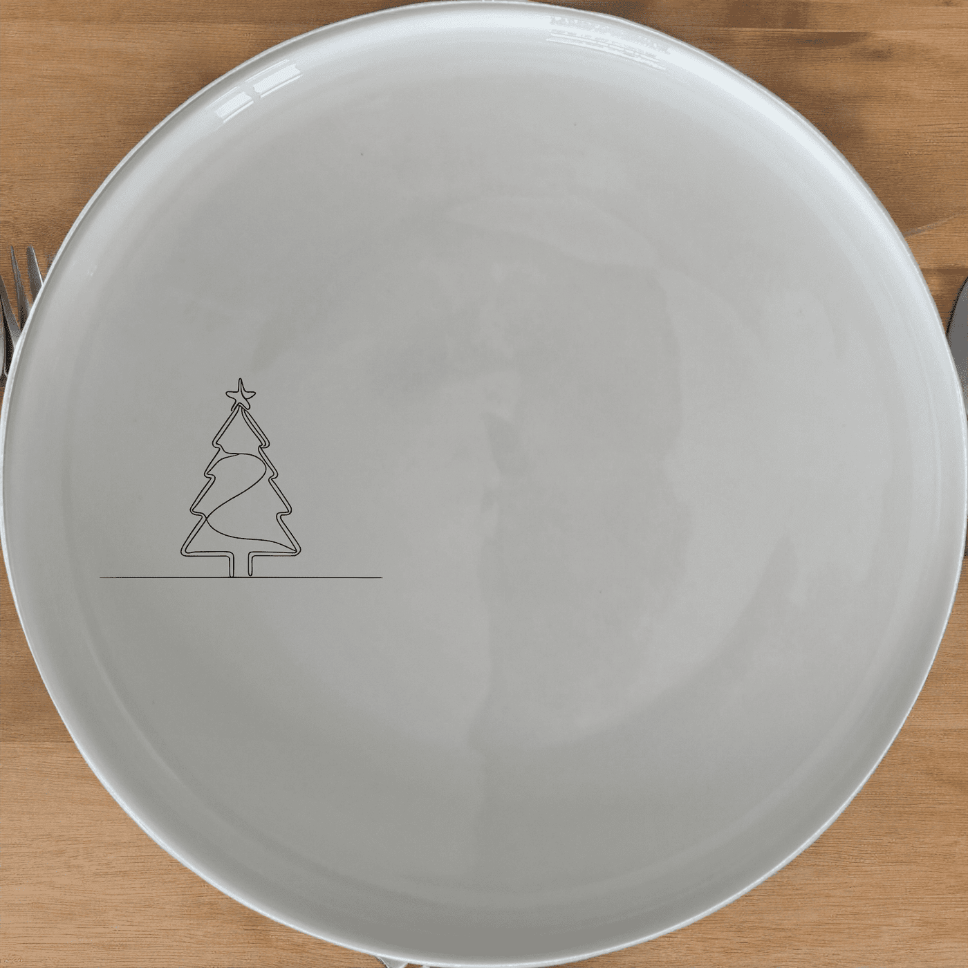 The Christmas Imagery Side Plate Set of 4 adds festive charm to your dining table with elegant Christmas tree designs.