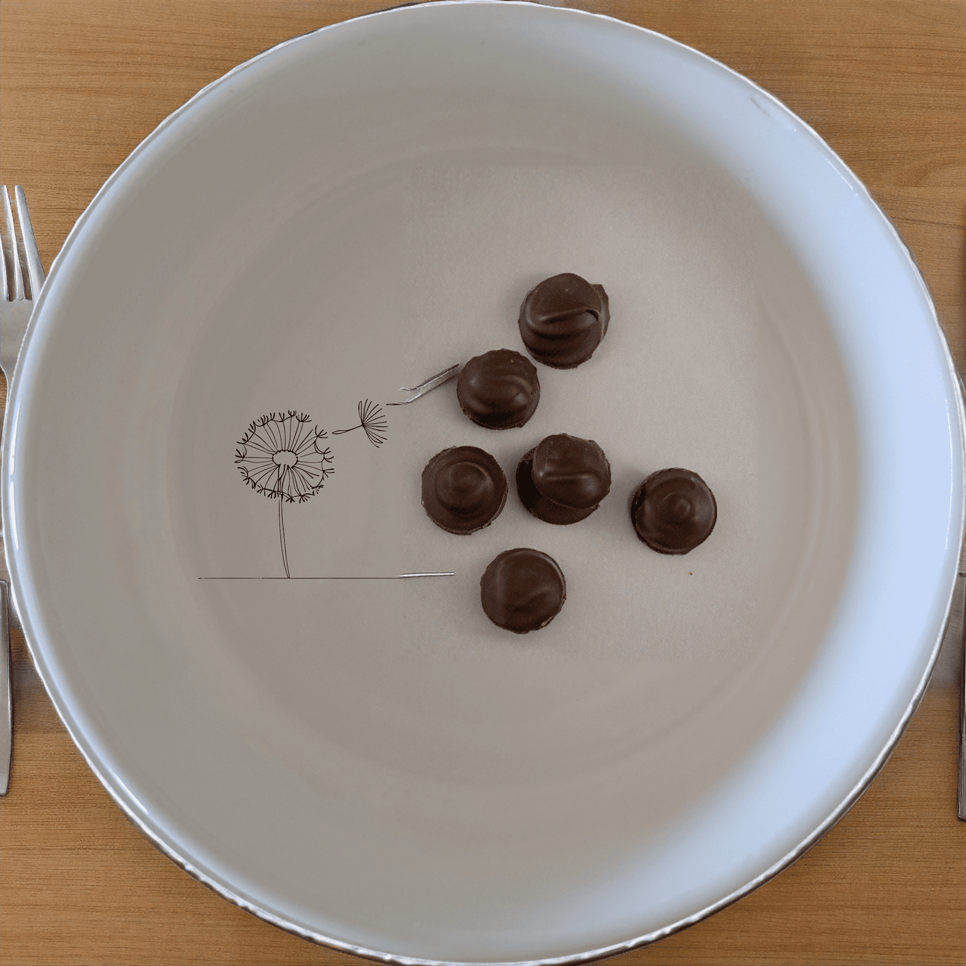 The Dandelion Seeds Wind Bowl Set of 4 features delicate laser-etched designs on white ceramic bowls, perfect for a modern and minimalist kitchen.