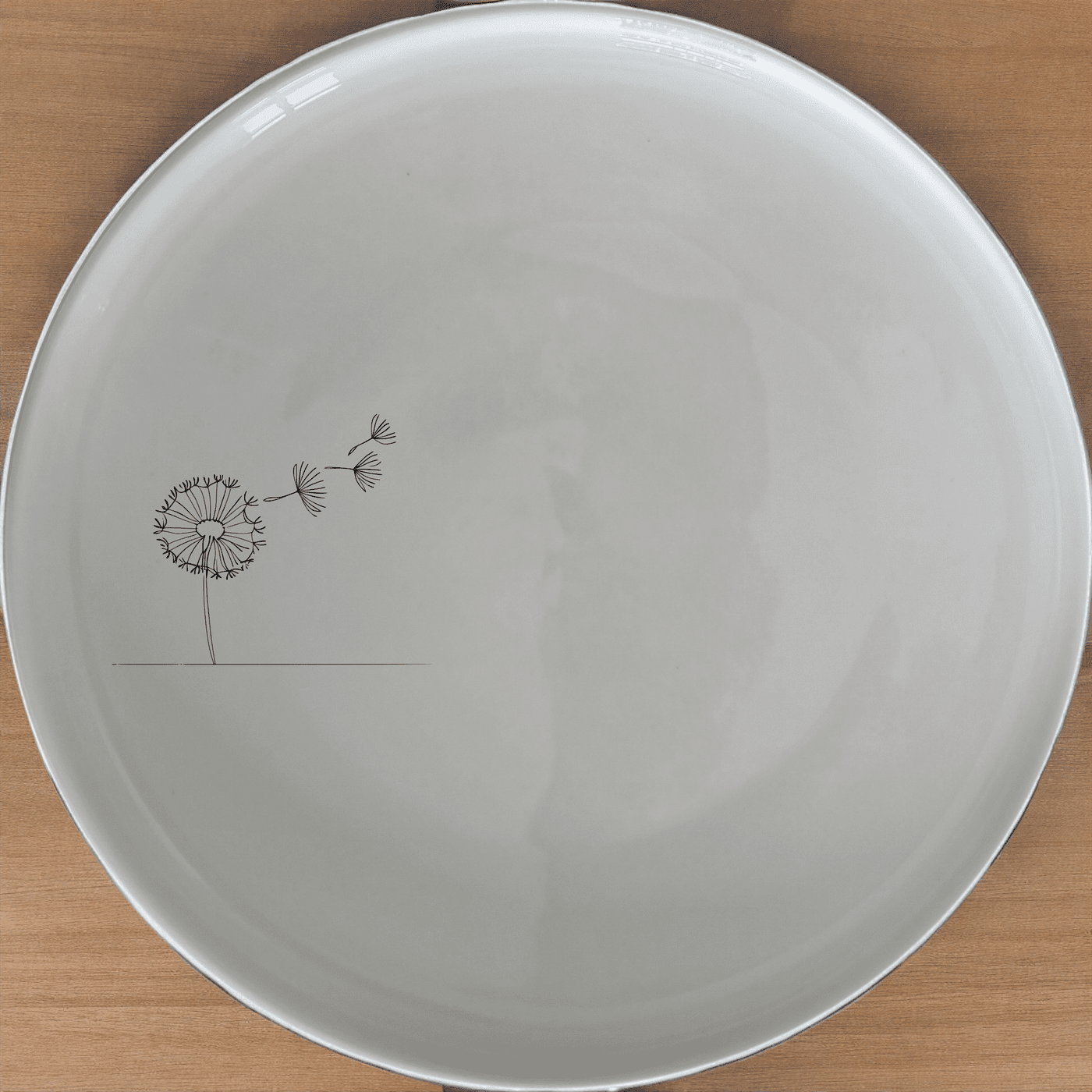The Dandelion Seeds Wind Side Plate Set of 4 features delicate laser-etched designs perfect for everyday elegance.