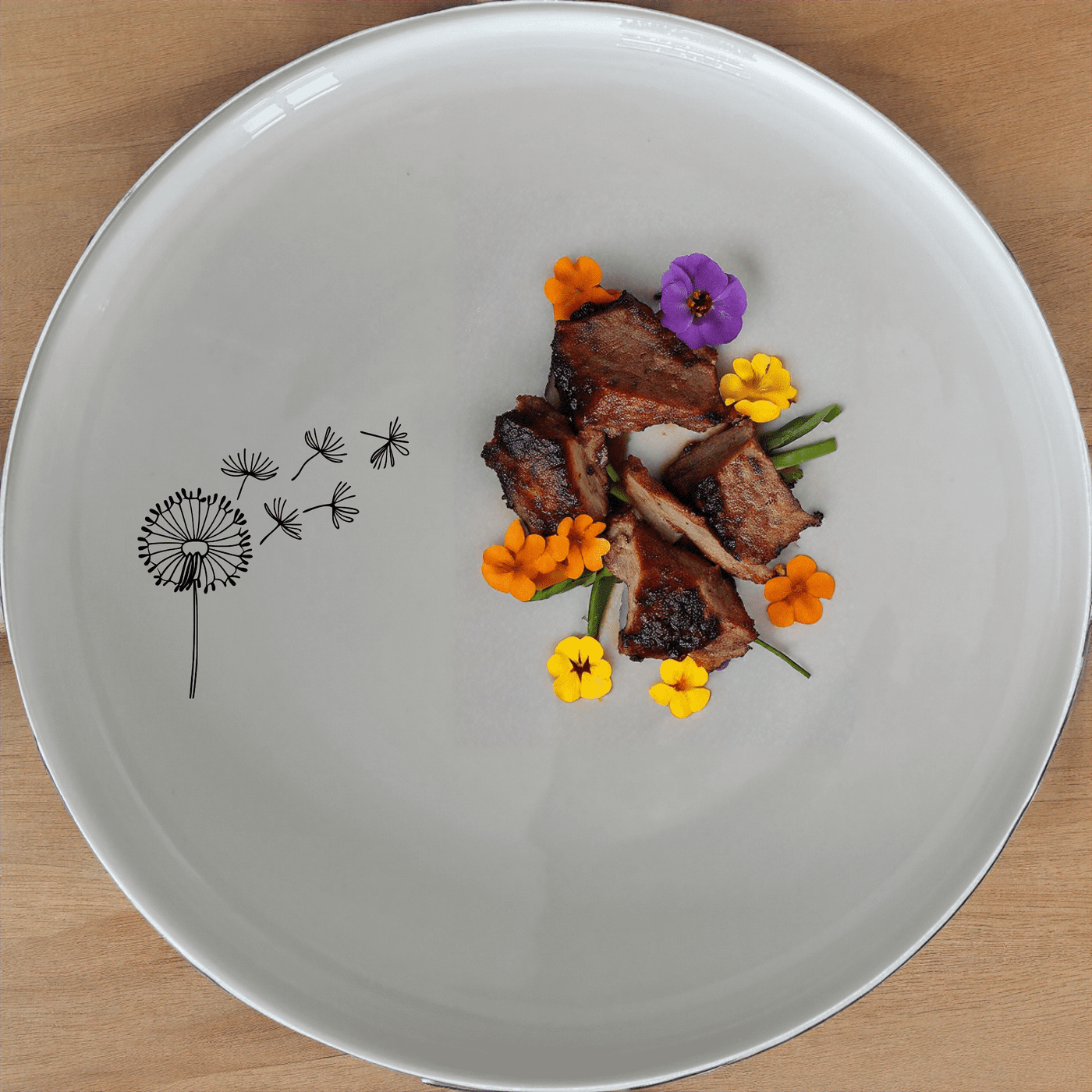 The Dandelion Seeds Side Plate Set of 4 features delicate laser-etched designs on white ceramic plates, perfect for everyday dining or special occasions.