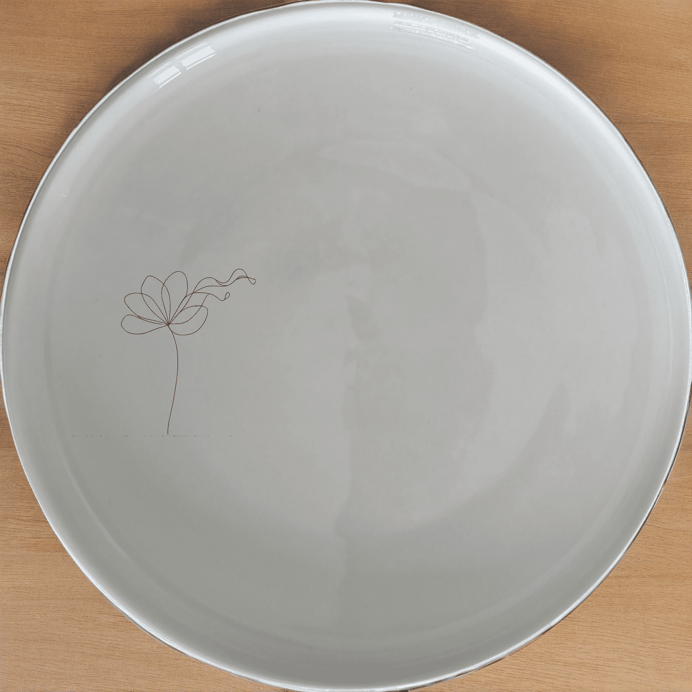 The Delicate Flower Petals Side Plate Set of 4 adds a touch of elegance to your dining table with its subtle, artistic design.