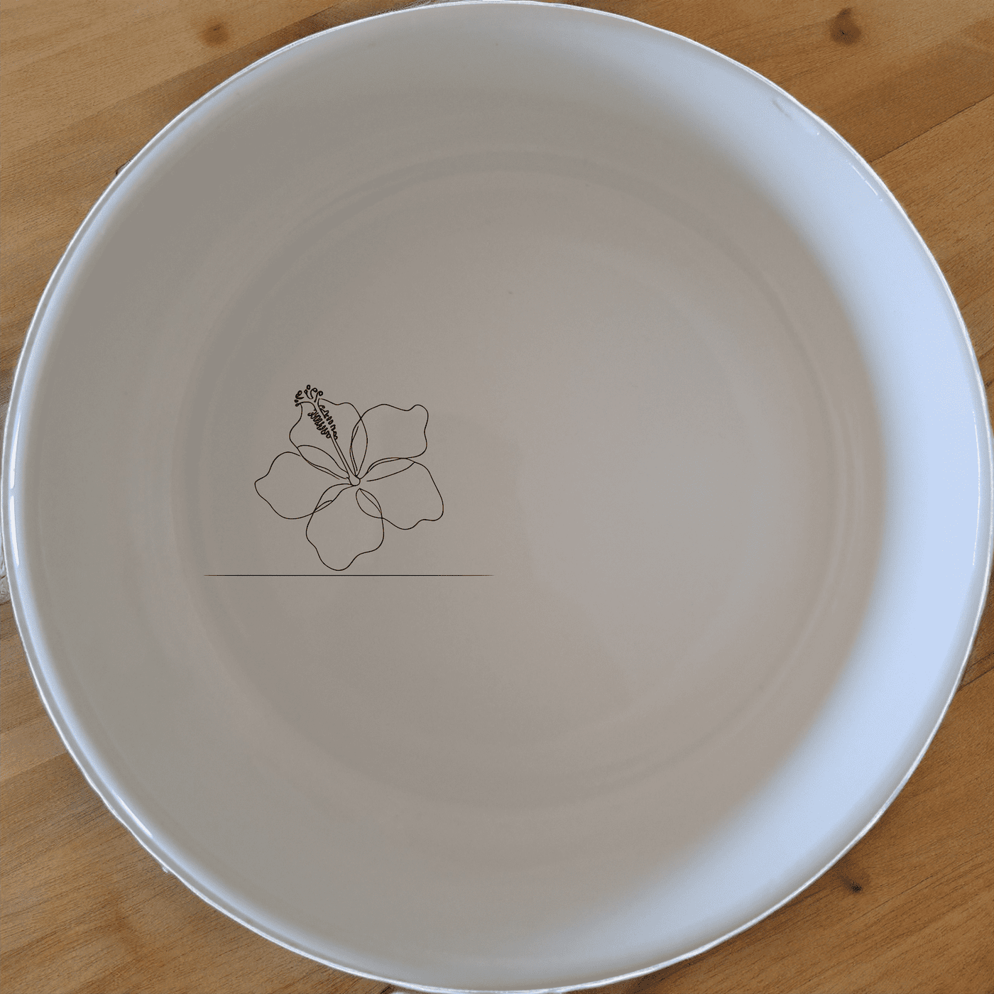 The Delicate Hibiscus Flower Bowl Set of 4 features a subtle, elegant design perfect for everyday use or special occasions.