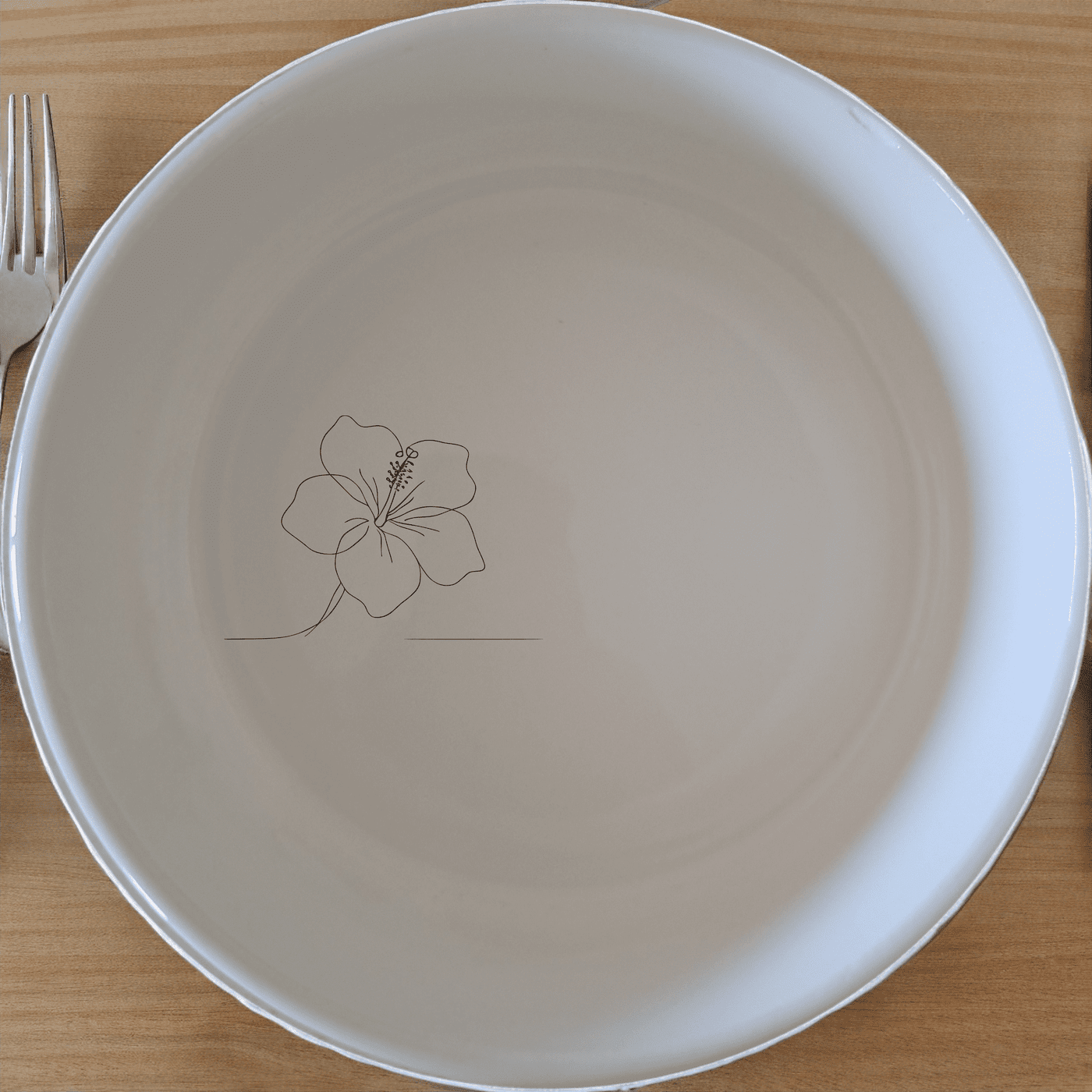 The Delicate Hibiscus Flower Bowl Set of 4 adds a touch of nature to your table setting with its subtle floral design.