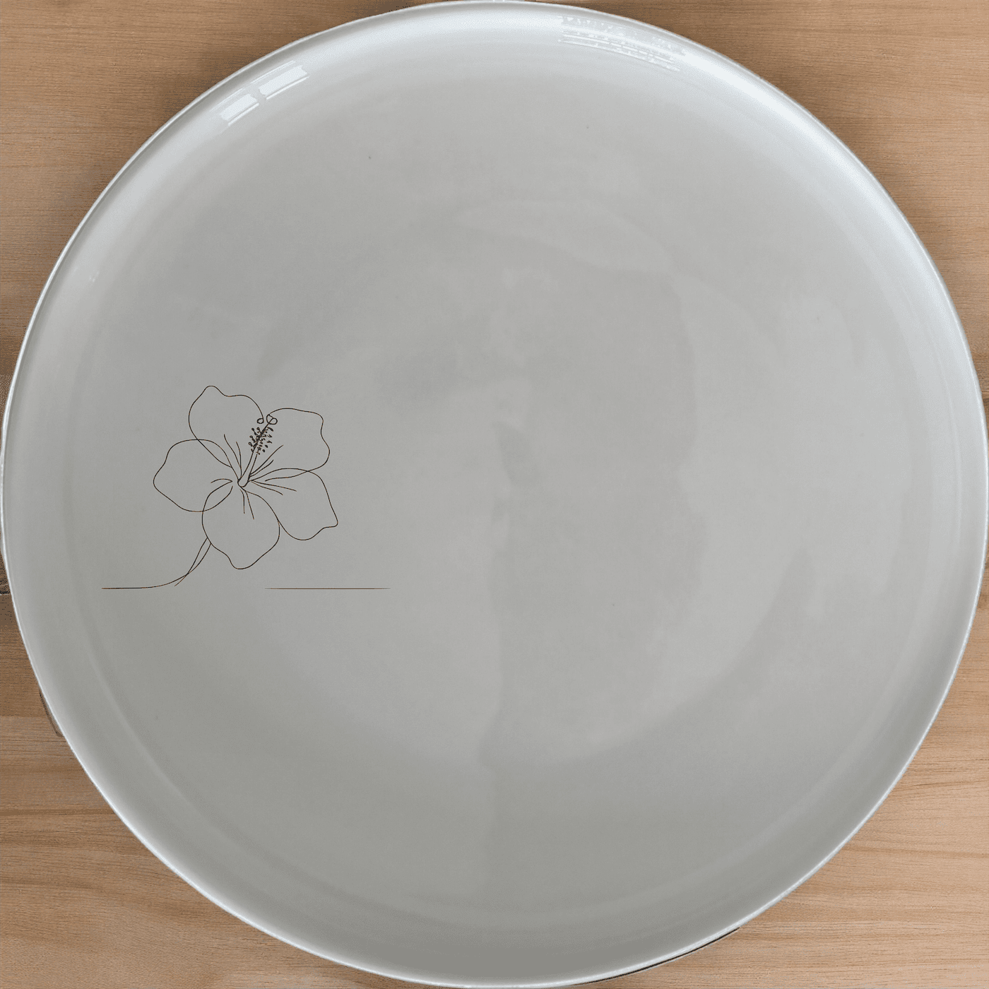 The Delicate Hibiscus Flower Side Plate Set of 4 adds a touch of elegance to your dining table with its subtle floral design.
