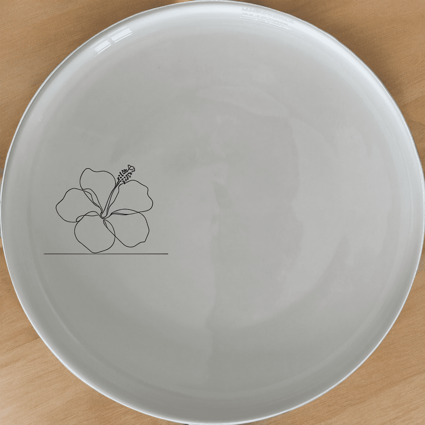 The Delicate Hibiscus Flower Side Plate Set of 4 adds a touch of elegance to your dining table with its subtle floral design.