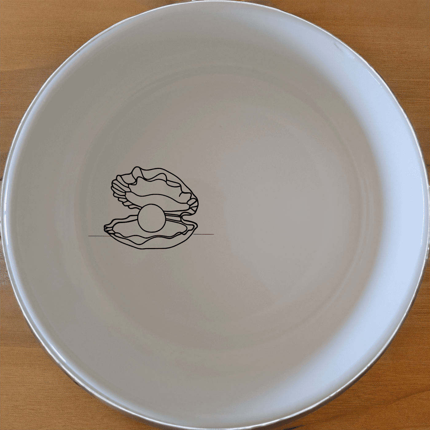 The Delicate Pearl Oyster Bowl Set of 4 features a subtle, elegant design perfect for any dining occasion. Crafted from premium ceramic, these bowls are both stylish and functional.