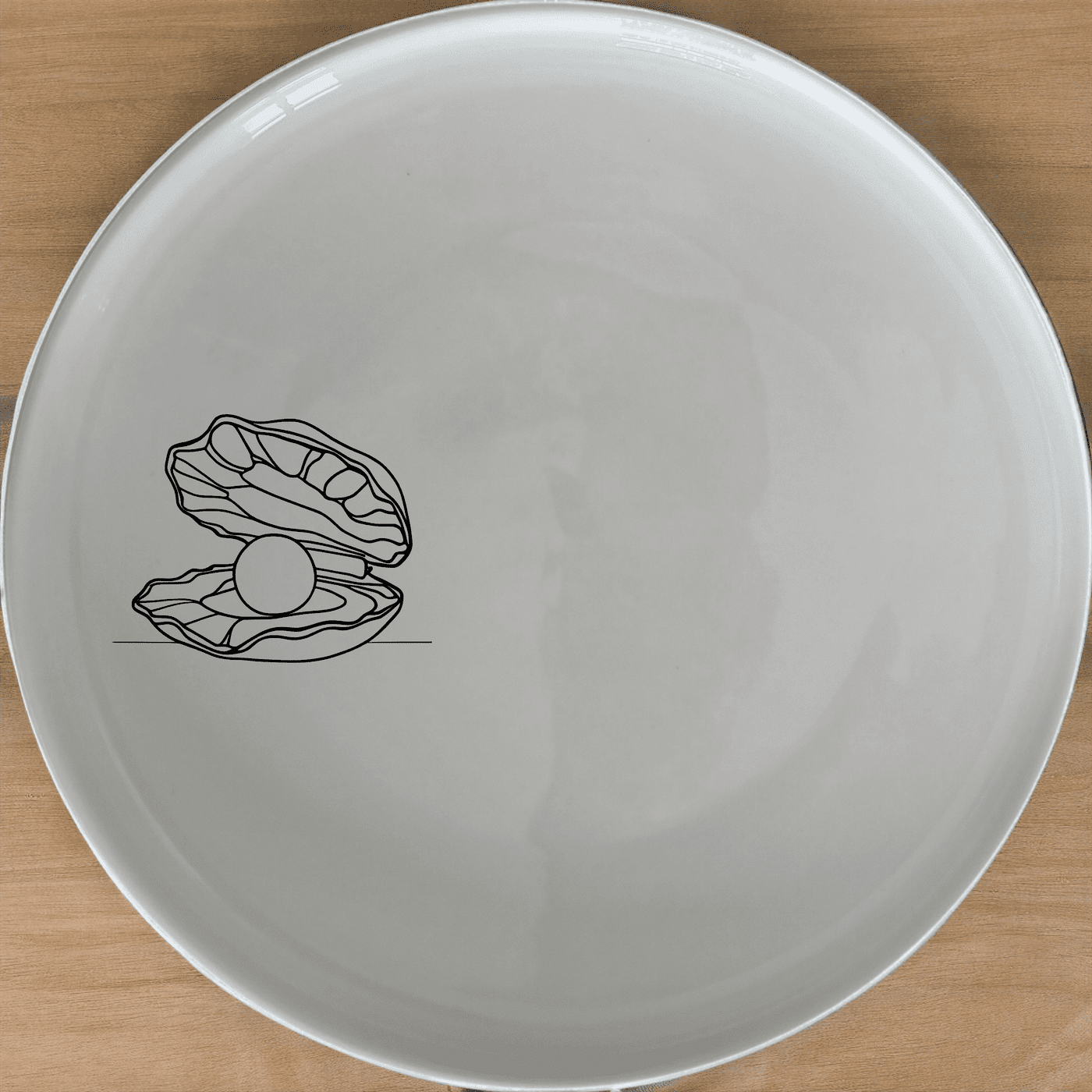 The Delicate Pearl Oyster Side Plate Set of 4 features an elegant design perfect for any dining occasion.