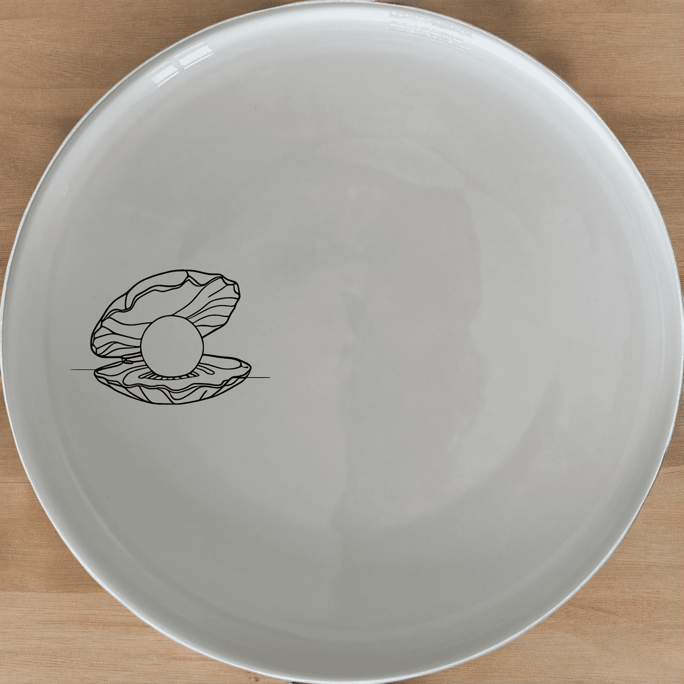 The Delicate Pearl Oyster Side Plate Set of 4 features a subtle, elegant design perfect for any dining occasion.