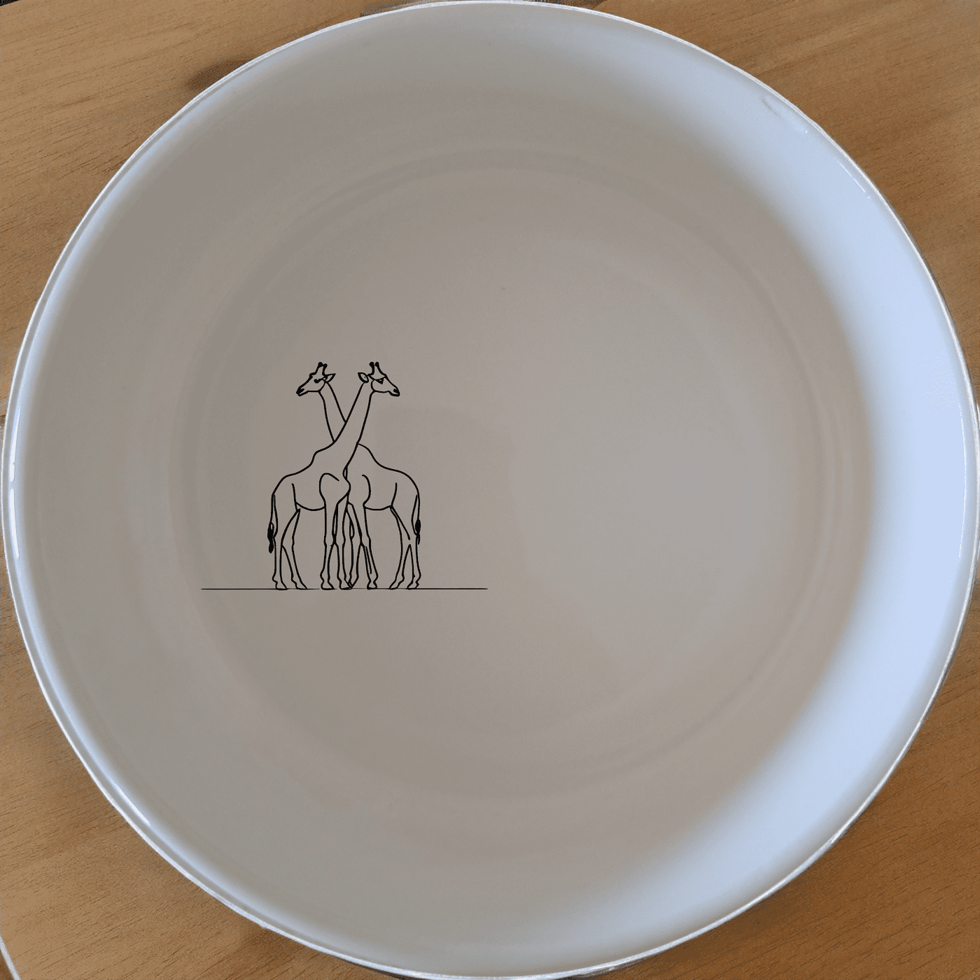 The Elongated Intertwined Giraffes Bowl Set of 4 features a unique design perfect for any home. This set combines style and functionality, making it an ideal choice for everyday use or special occasions.