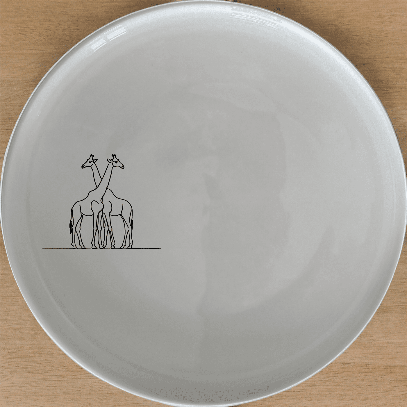 The Elongated Intertwined Giraffes Dinner Plate Set of 4 features a unique design that adds a touch of elegance to any dining table.