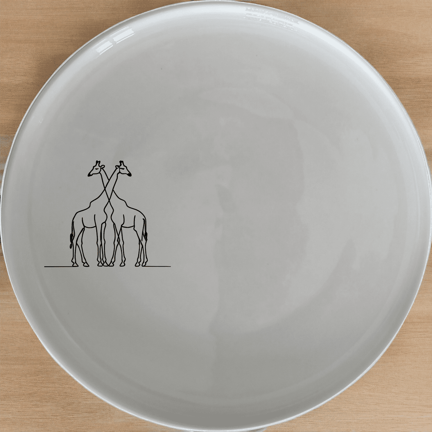 Elongated Intertwined Giraffes Side Plate Set of 4 offers a unique and stylish addition to any dining table, perfect for modern and contemporary home decor.