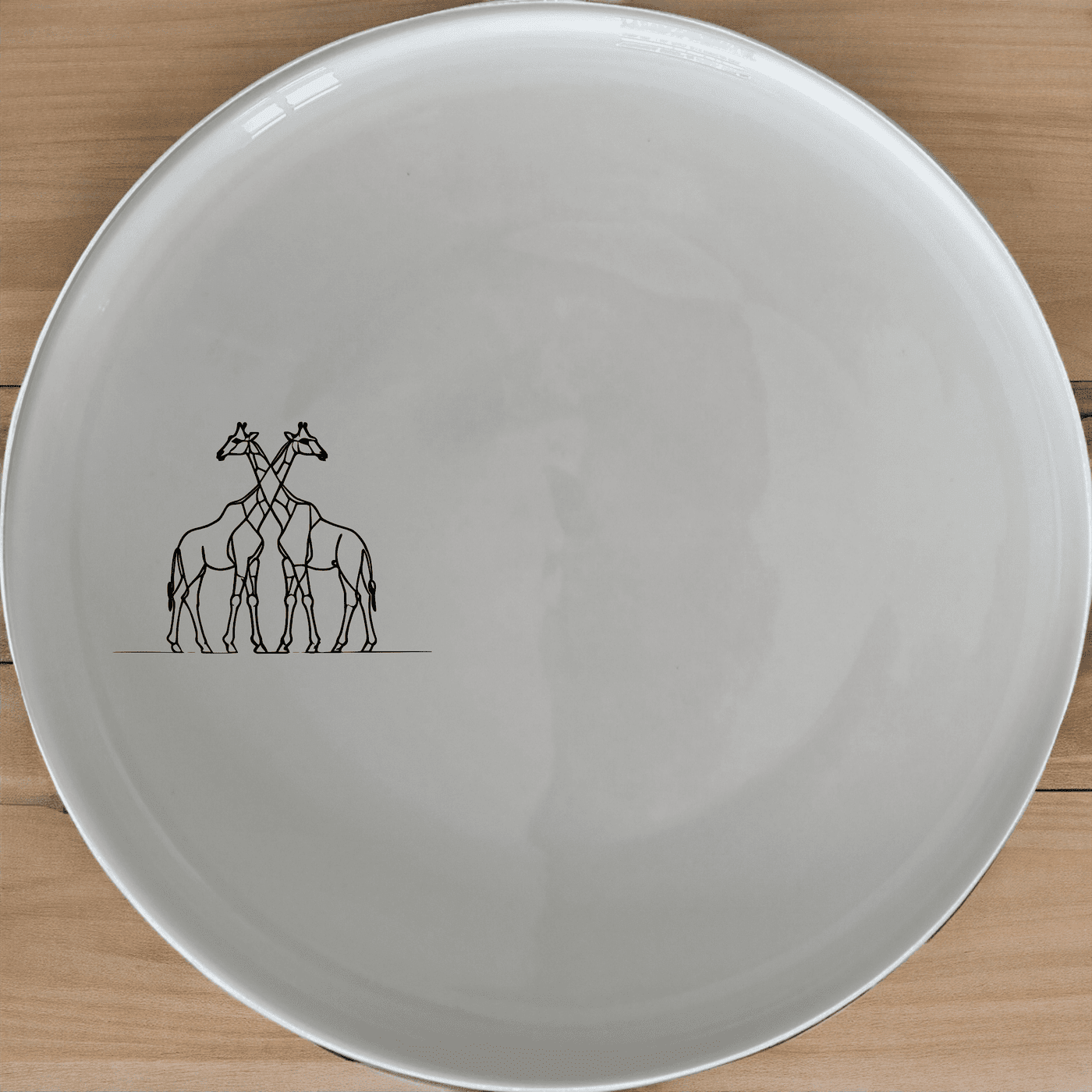 The Elongated Intertwined Girraffes Side Plate Set of 4 features a unique design perfect for modern dining. Crafted from ceramic, these plates are both stylish and functional.