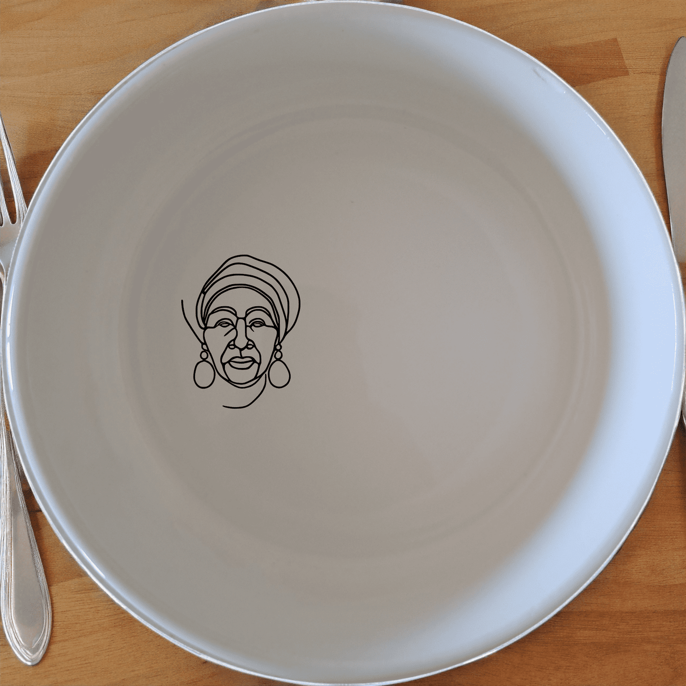 The Face Of Old African Woman Bowl Set of 4 is a beautifully crafted set of four ceramic bowls, each featuring an elegant laser-etched portrait of an African woman. Perfect for everyday use or special occasions.