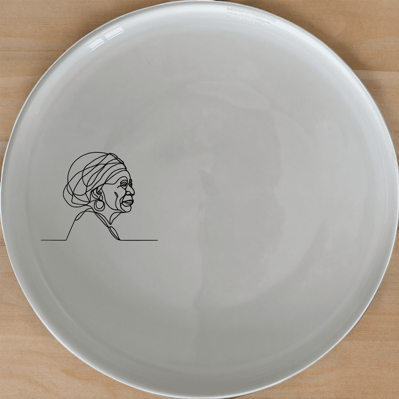 The Face Old African Woman Dinner Plate Set of 4 is a striking and culturally rich addition to any dining collection.