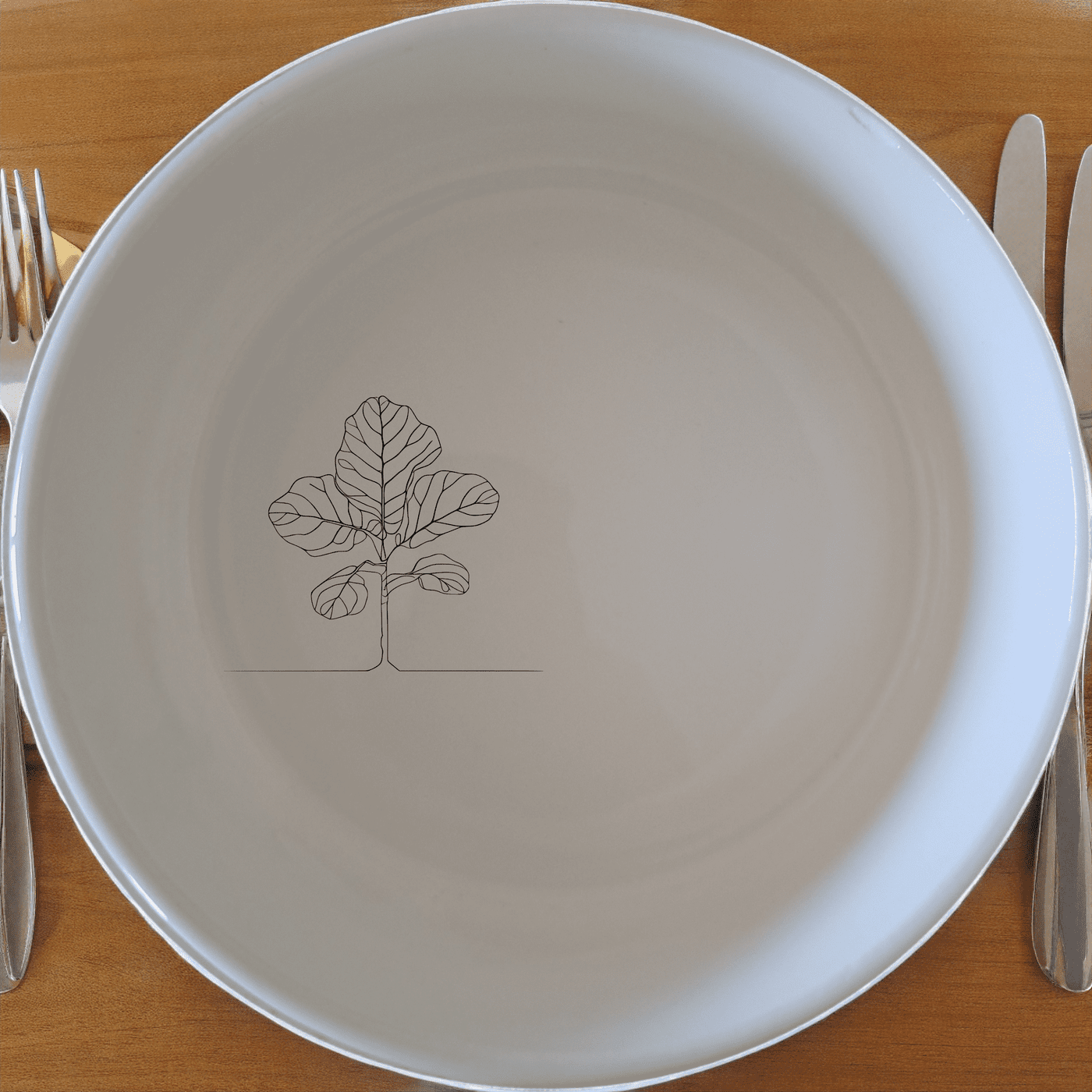 The Fiddle Leaf Bowl Set of 4 adds a touch of nature to your dining table with its elegant design and versatile use.