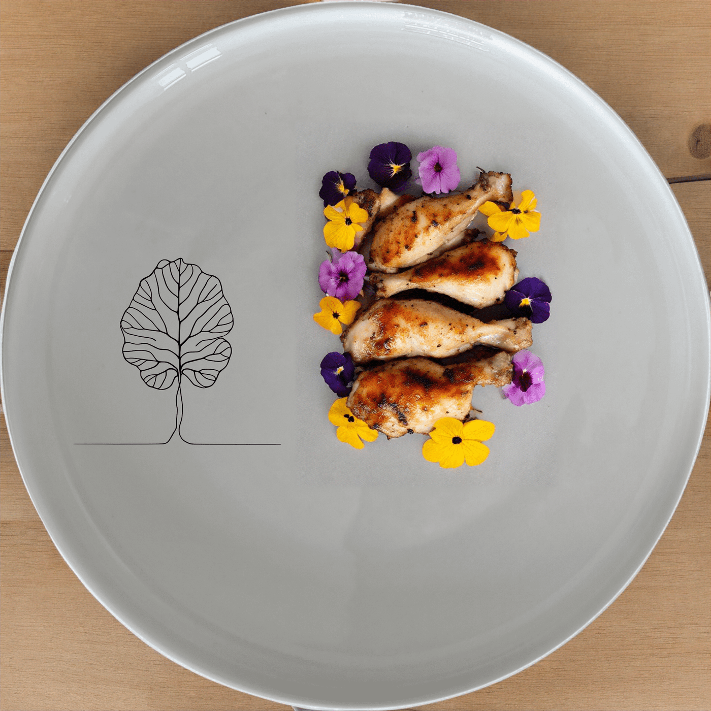 The Fiddle Leaf Dinner Plate Set of 4 features a minimalist design with a subtle leaf motif, perfect for modern dining.